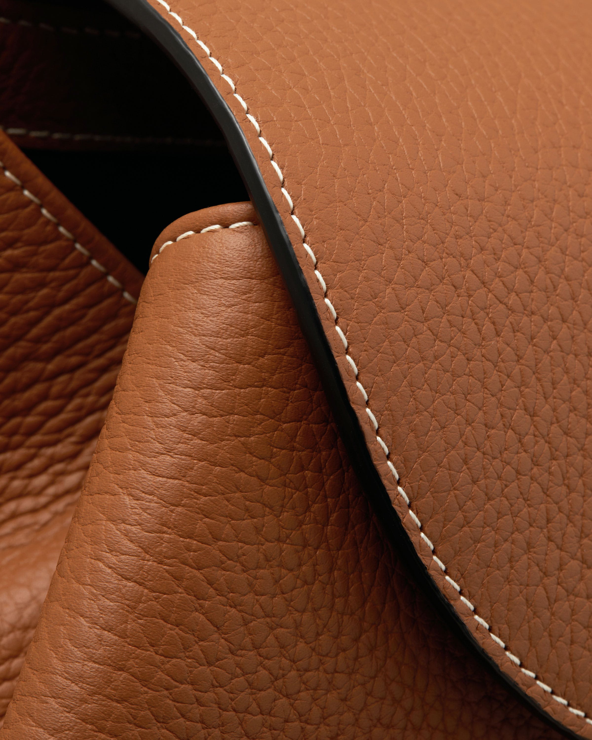 A close up of a brown leather material