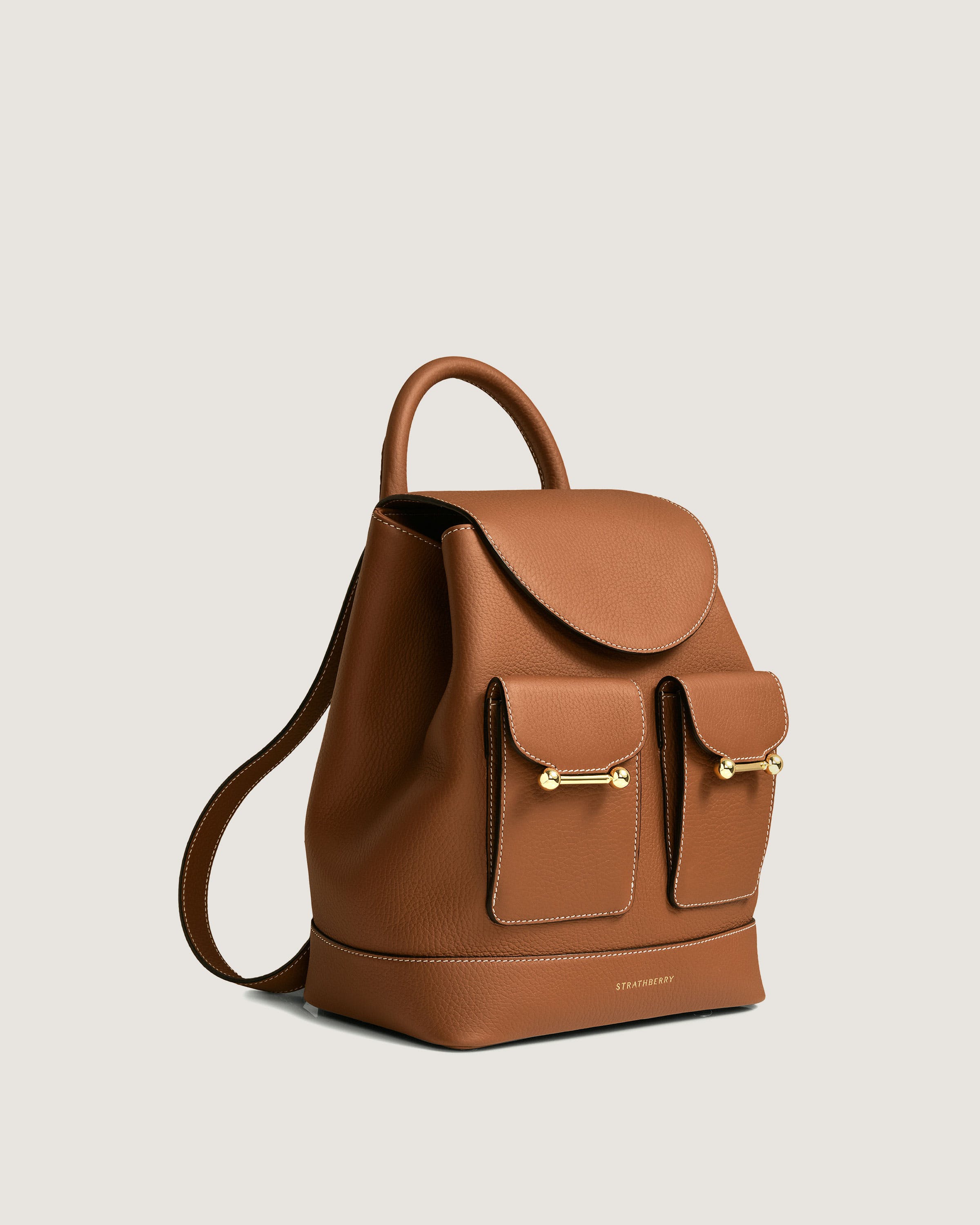 A brown leather backpack with two compartments