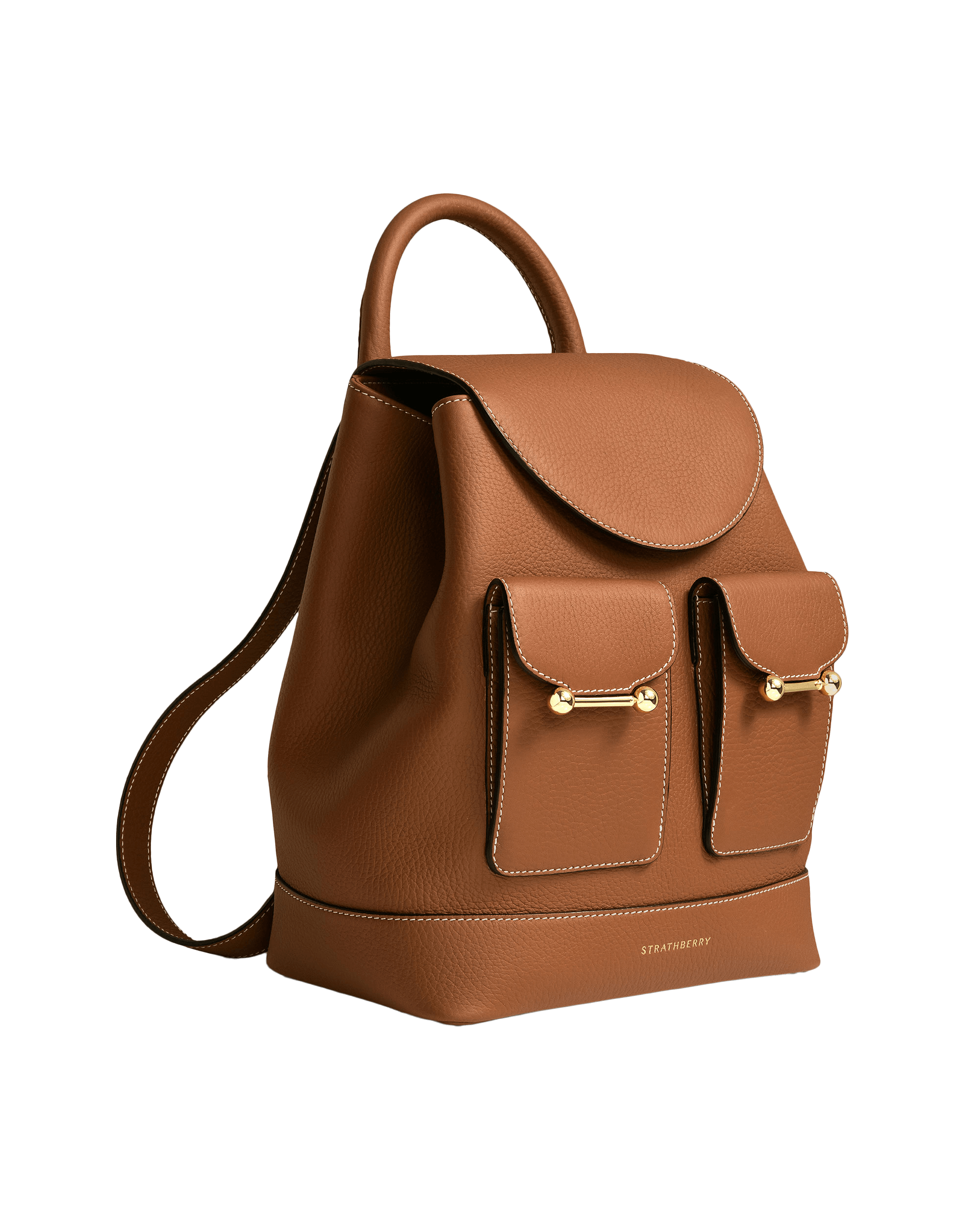 A brown leather handbag on a green background