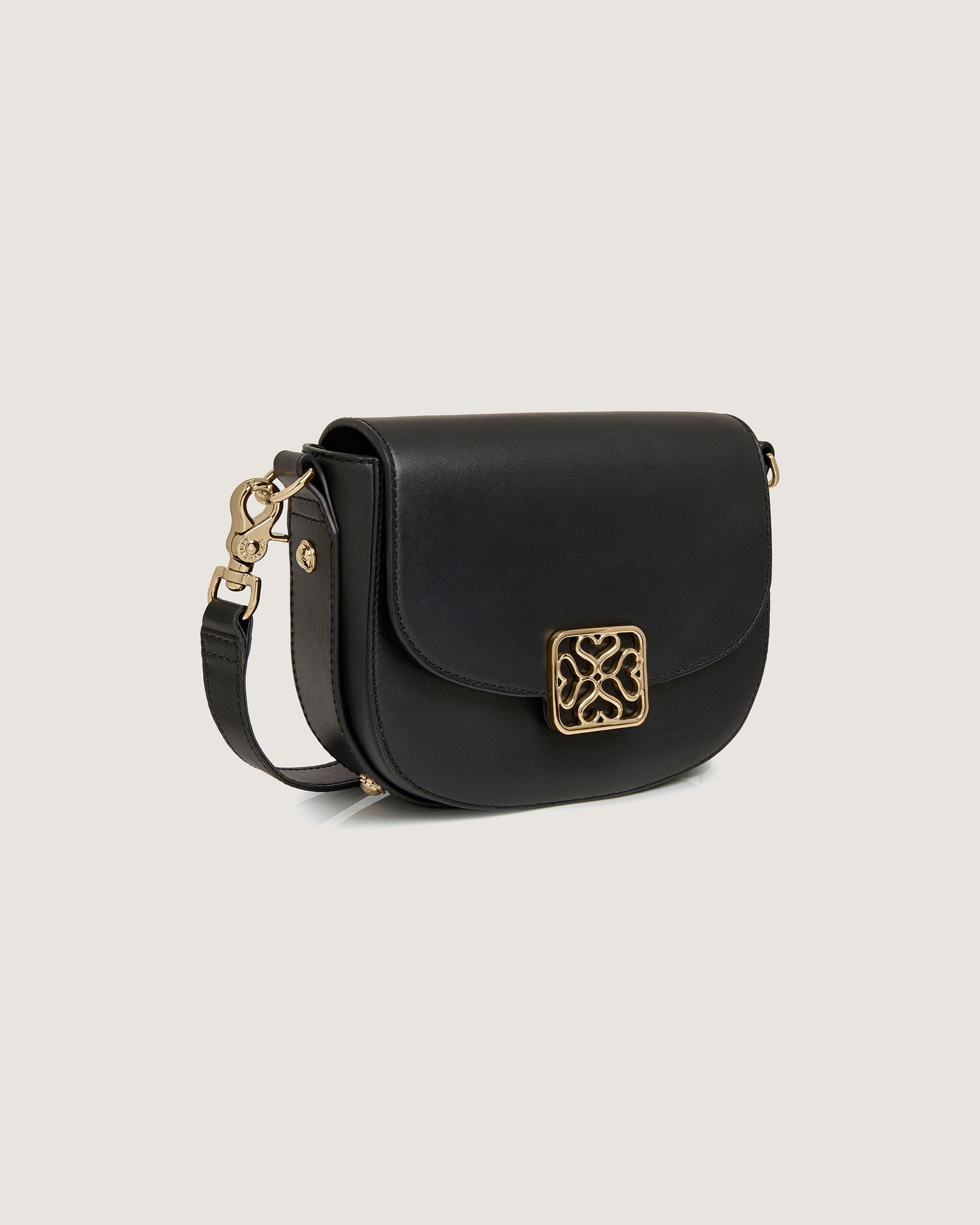 A black cross body bag on a white background