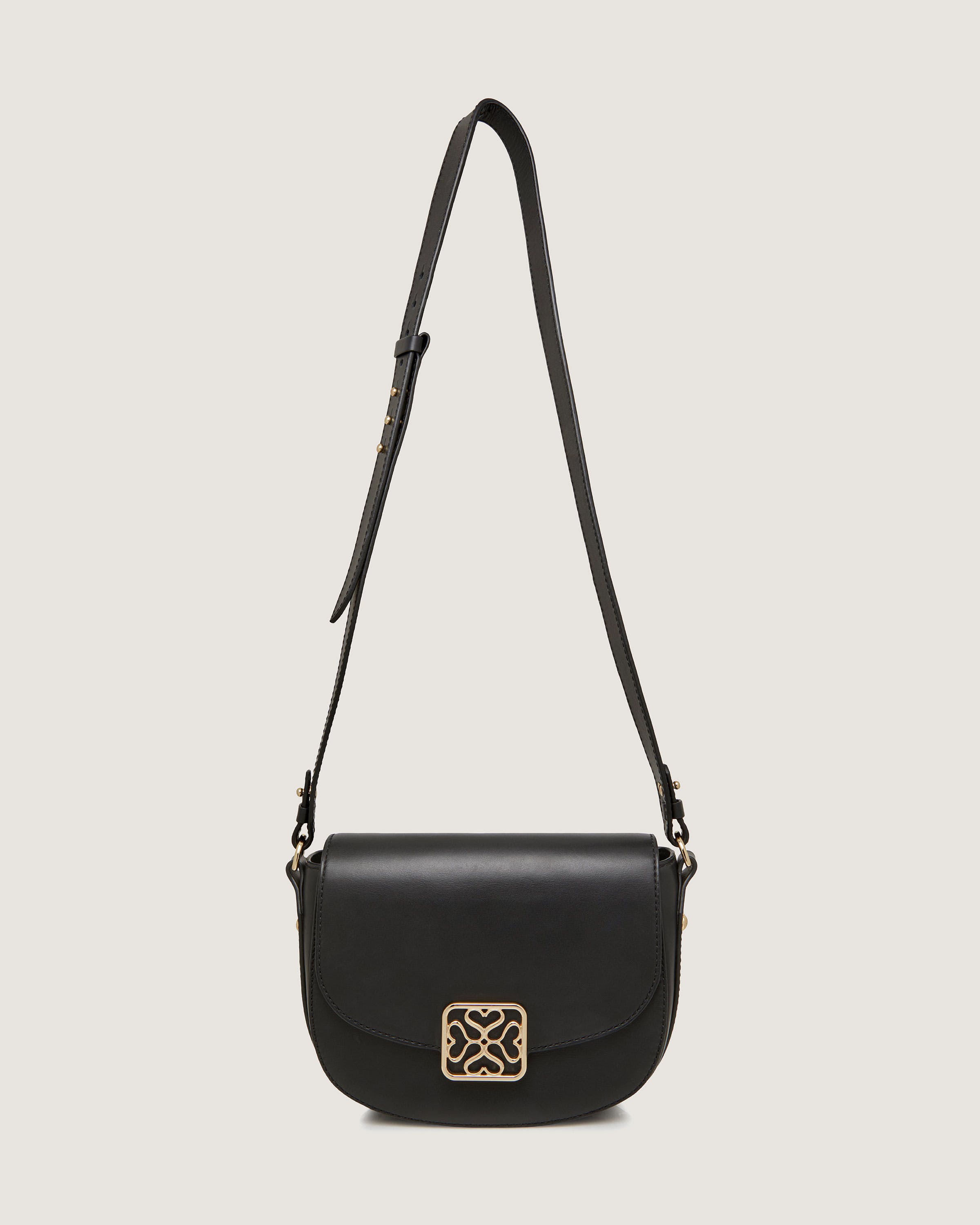 A black purse with a gold buckle