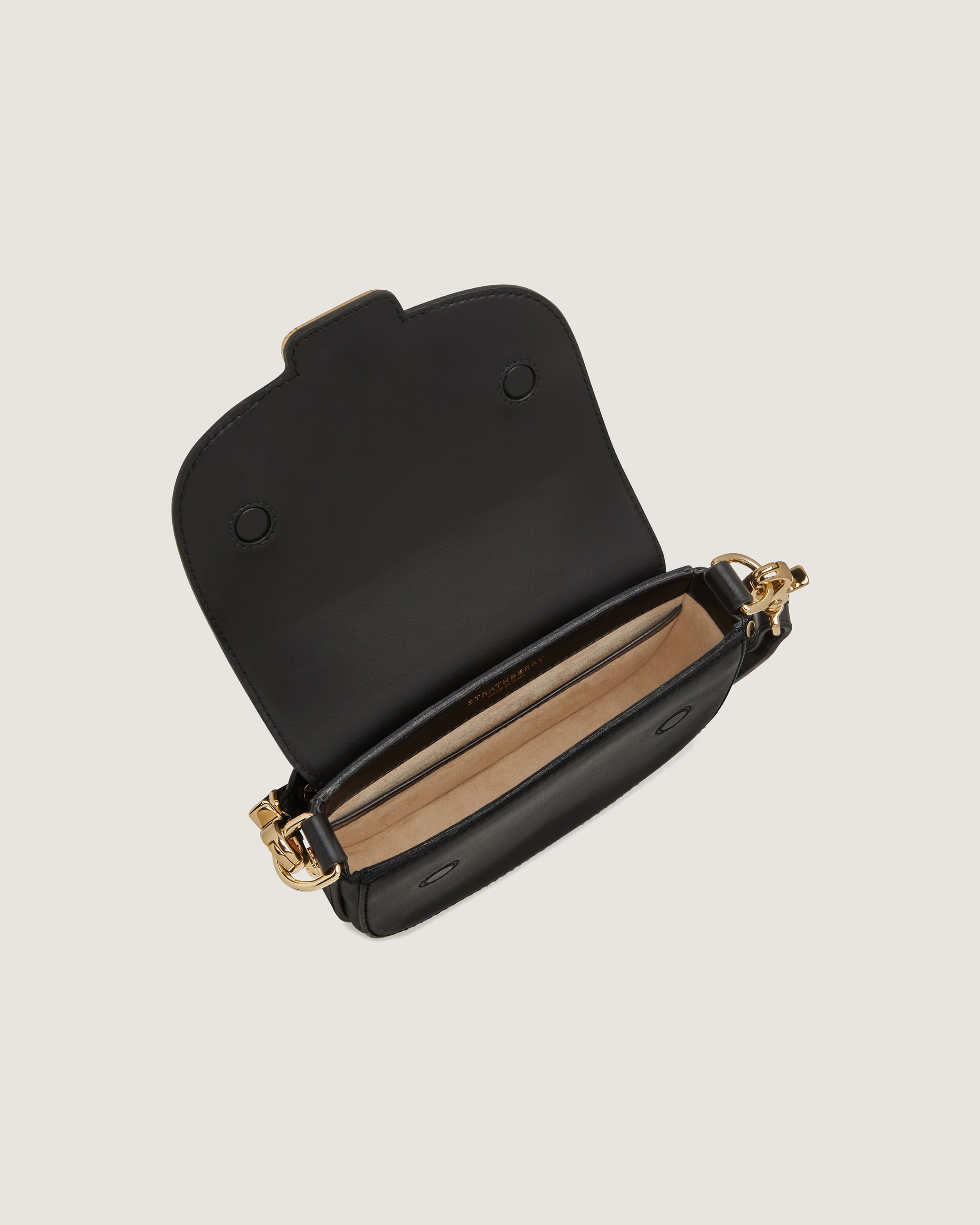 A small black purse with a gold chain