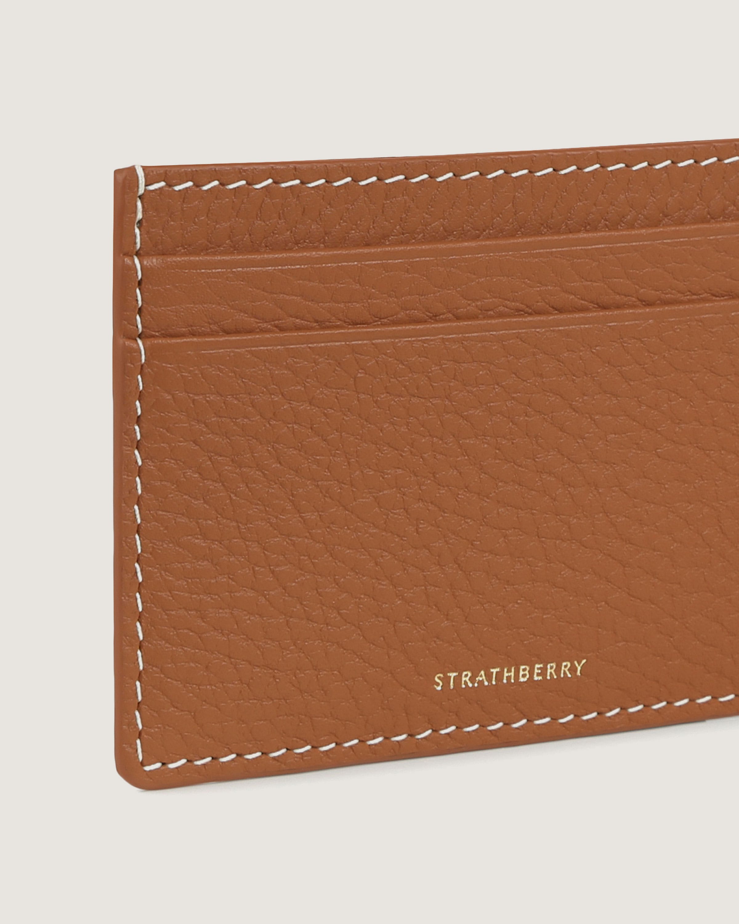 A brown card case with a white stitch