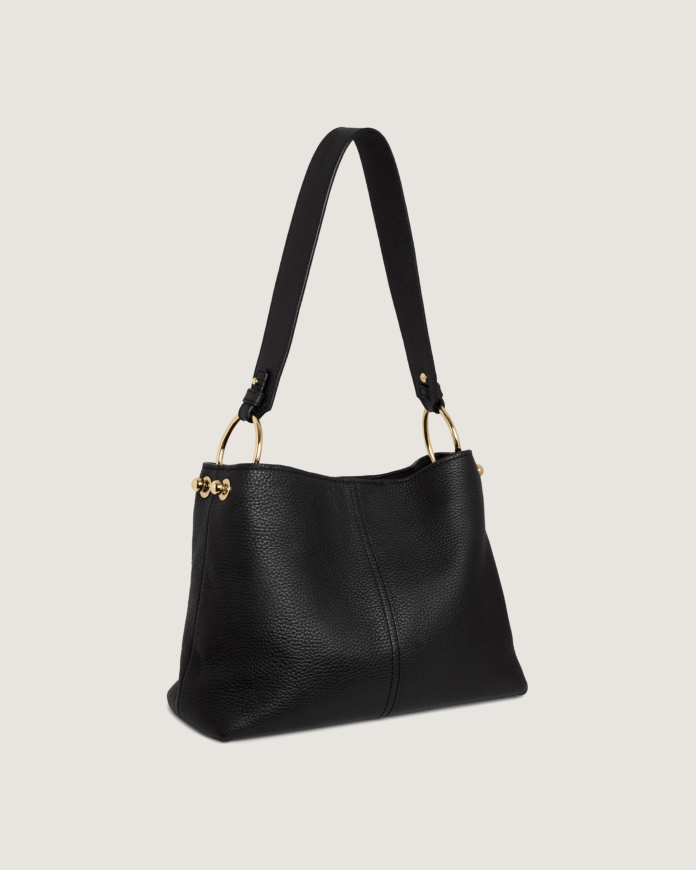 A black handbag with a gold handle