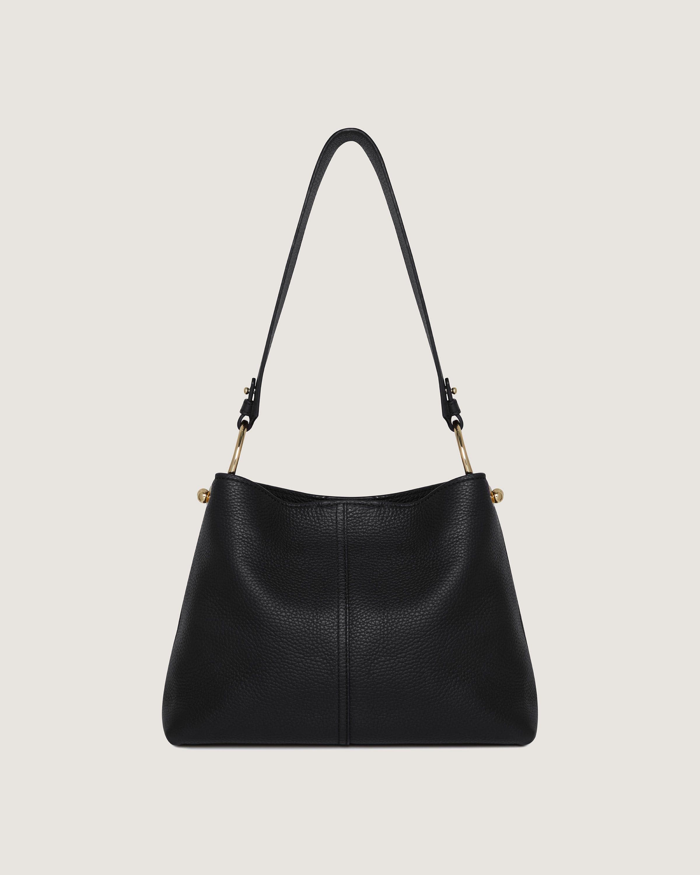 A black handbag with a gold handle