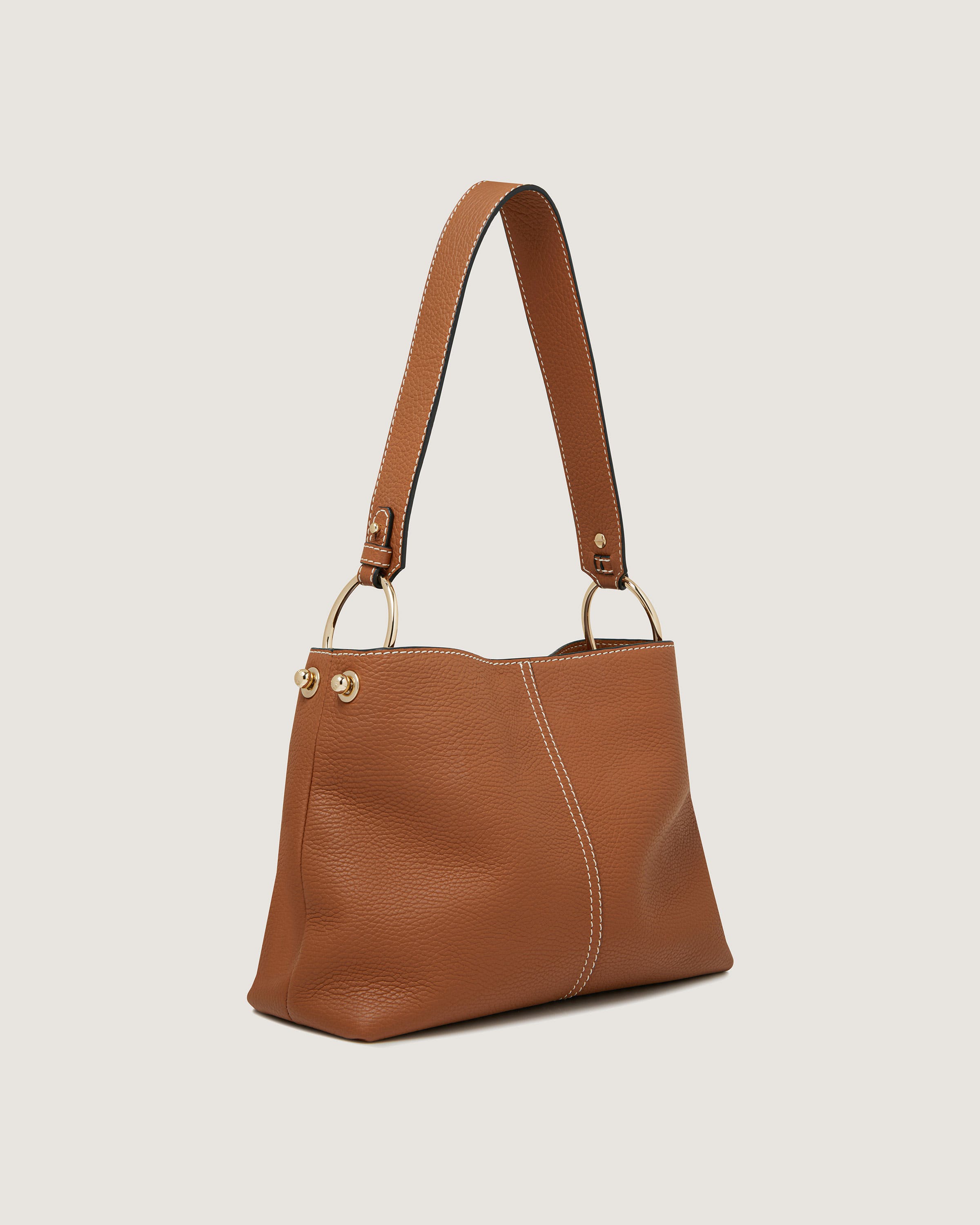 A brown leather handbag with a strap