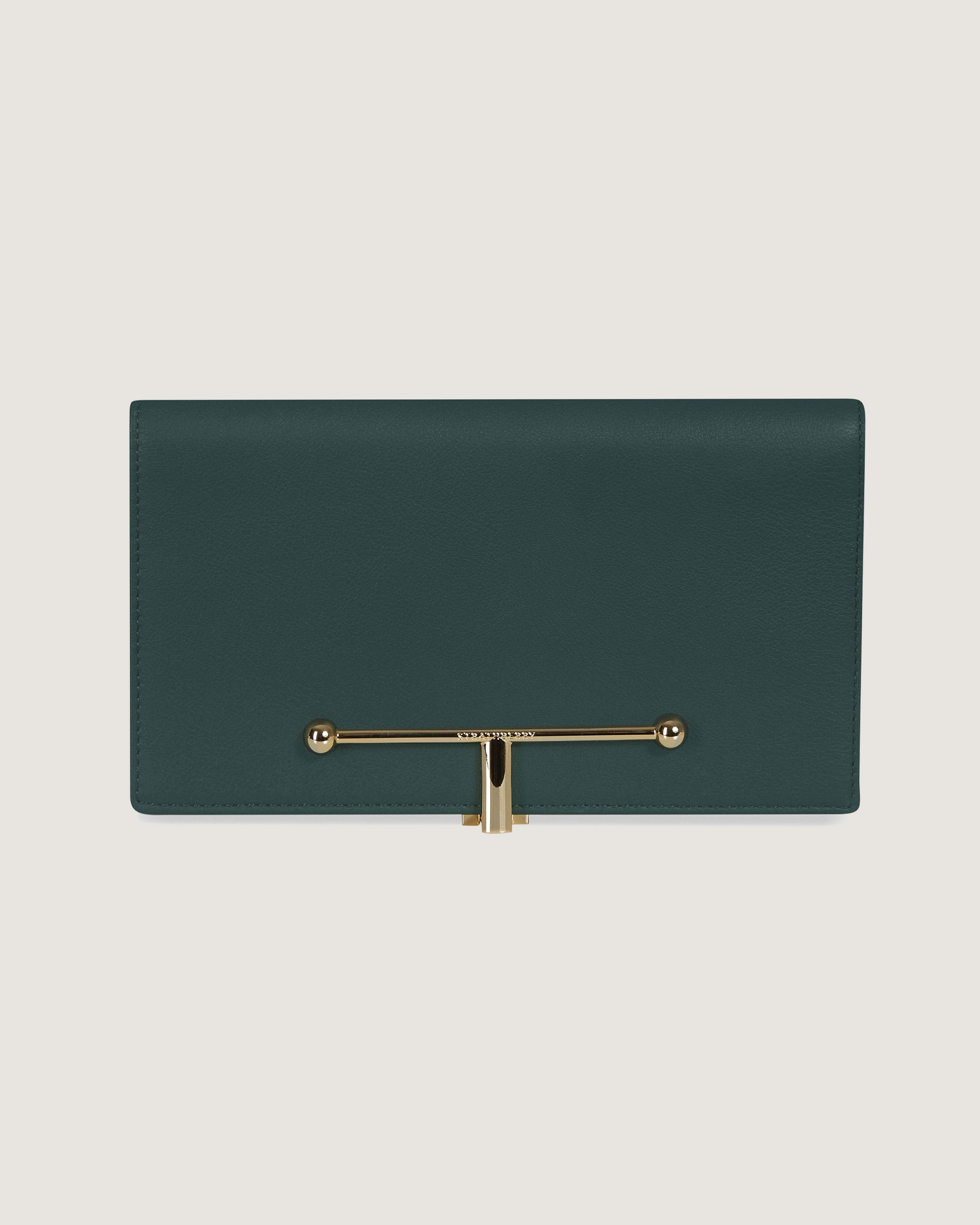 A green leather purse with a gold handle