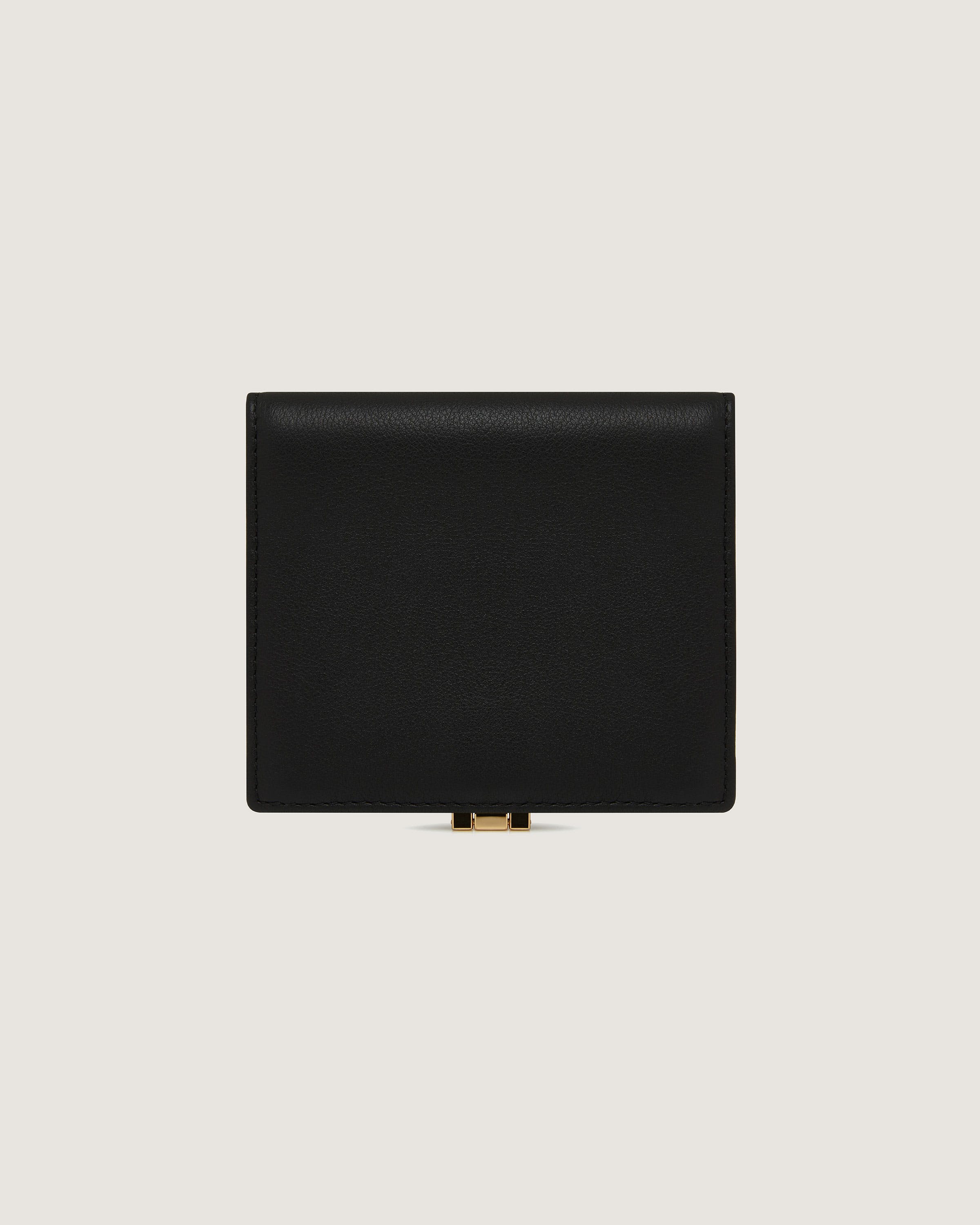 A black leather wallet on a white background