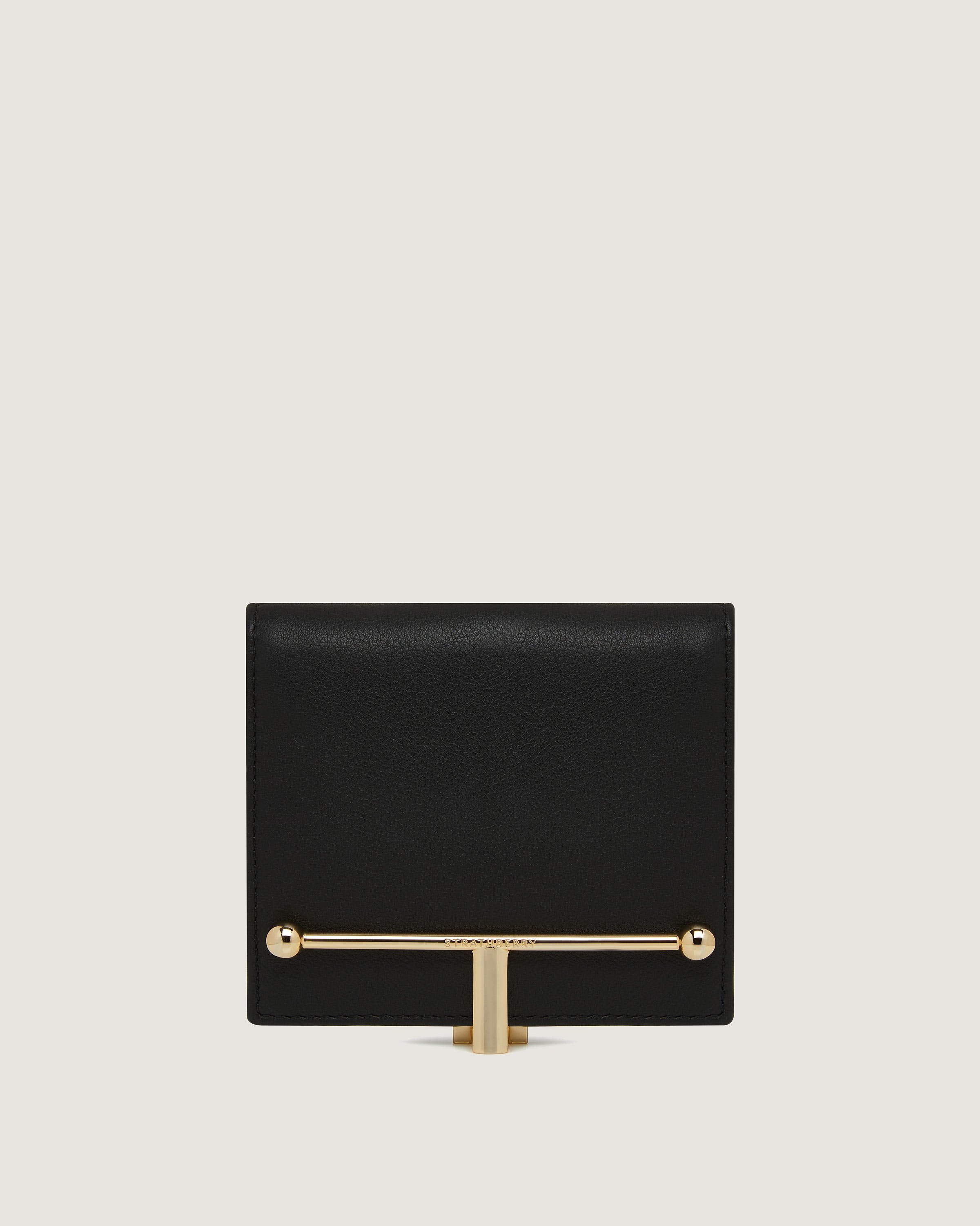 A black and gold clutch bag