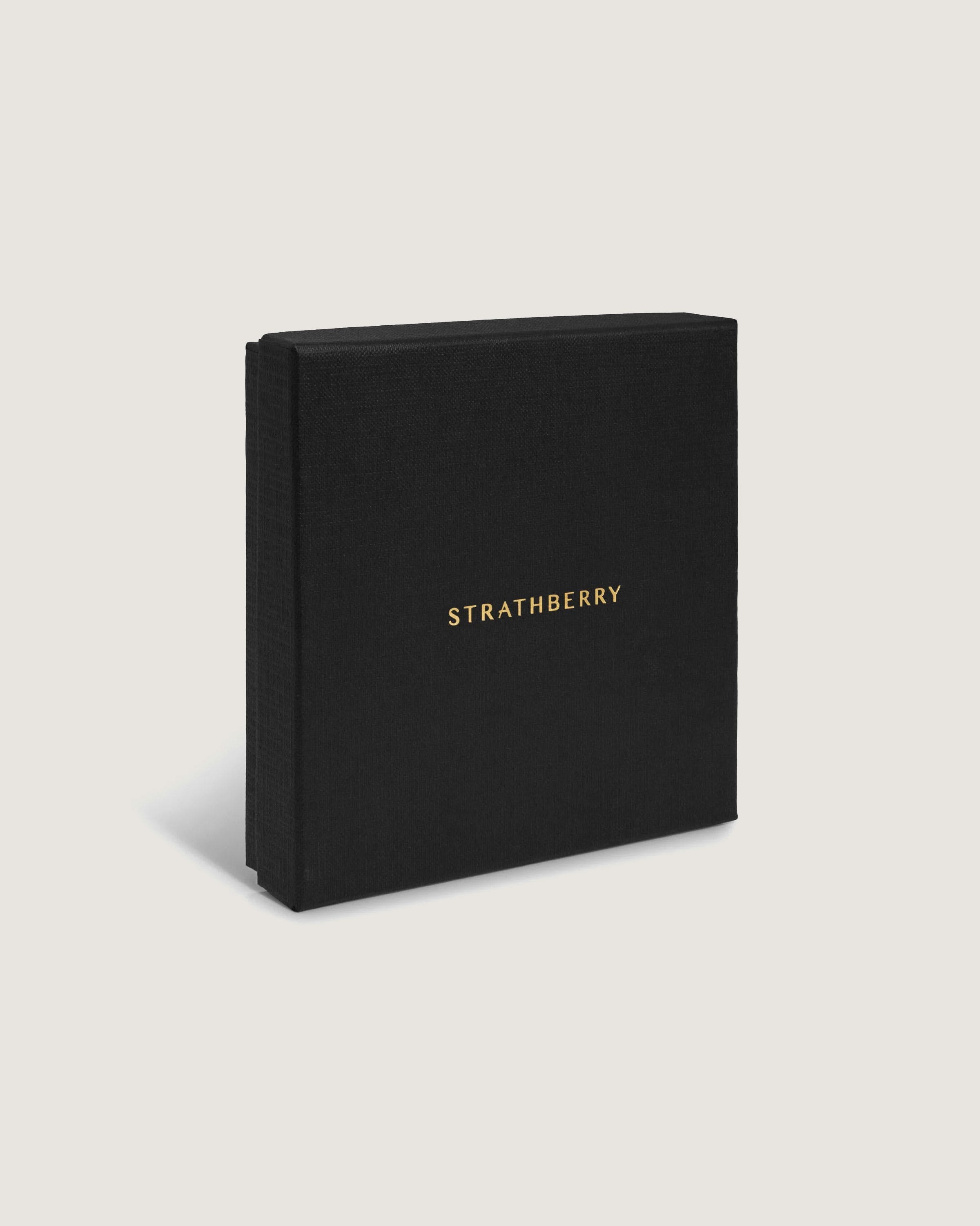 A black book with gold lettering on it