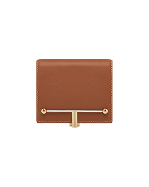 A brown leather wallet with a gold handle