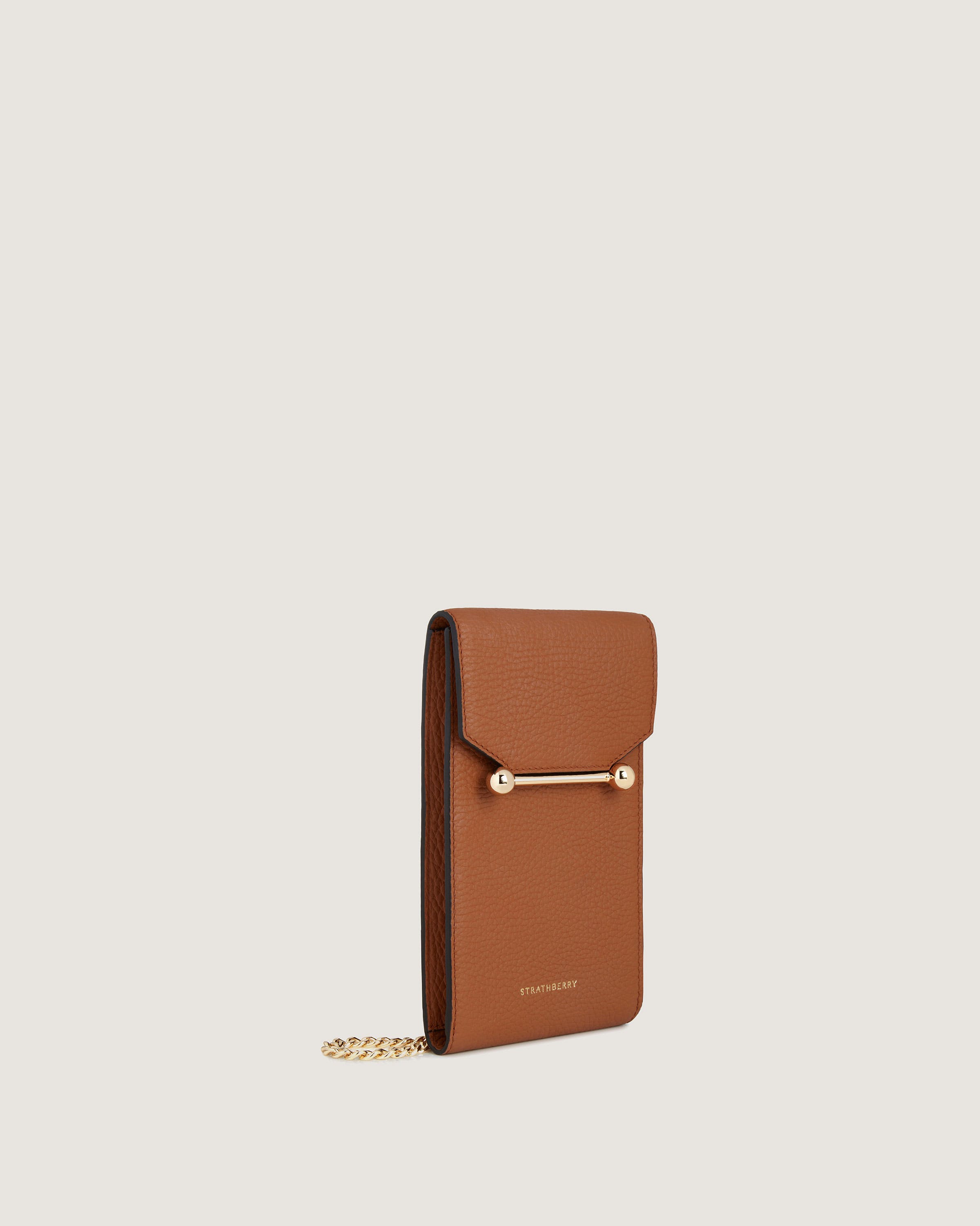 A brown wallet with a chain hanging from it