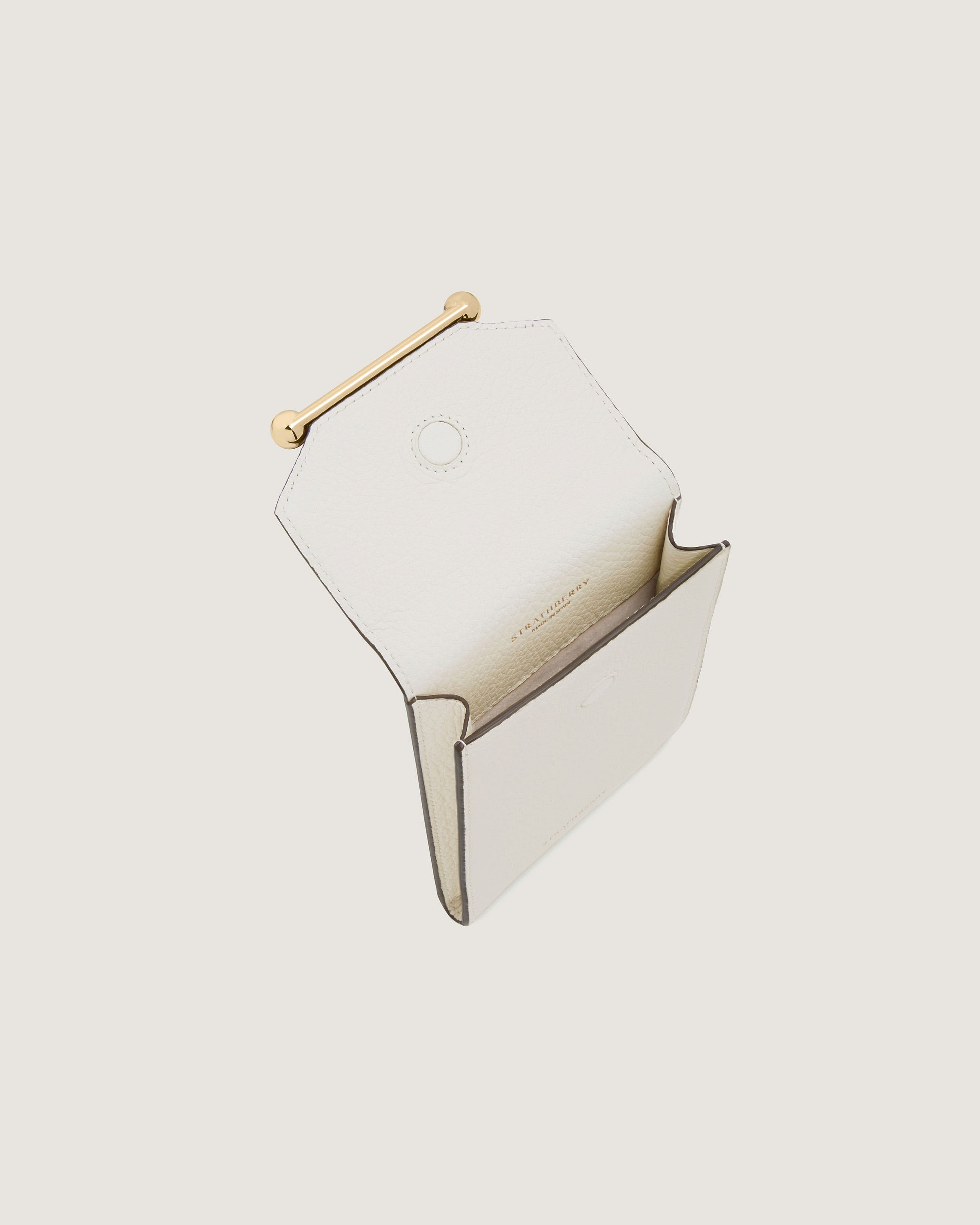 A white box with a gold handle on a white background