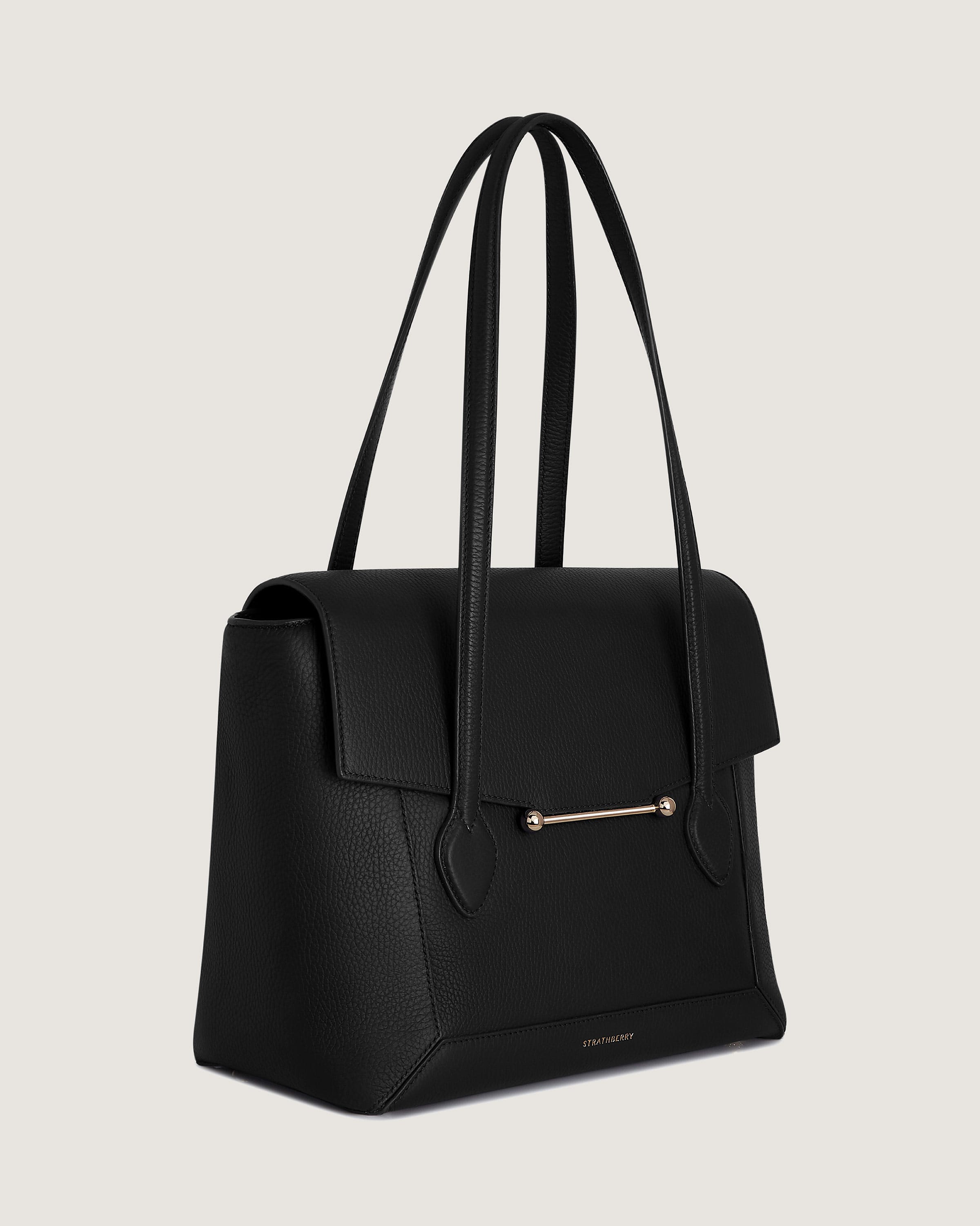 A black handbag on a white background