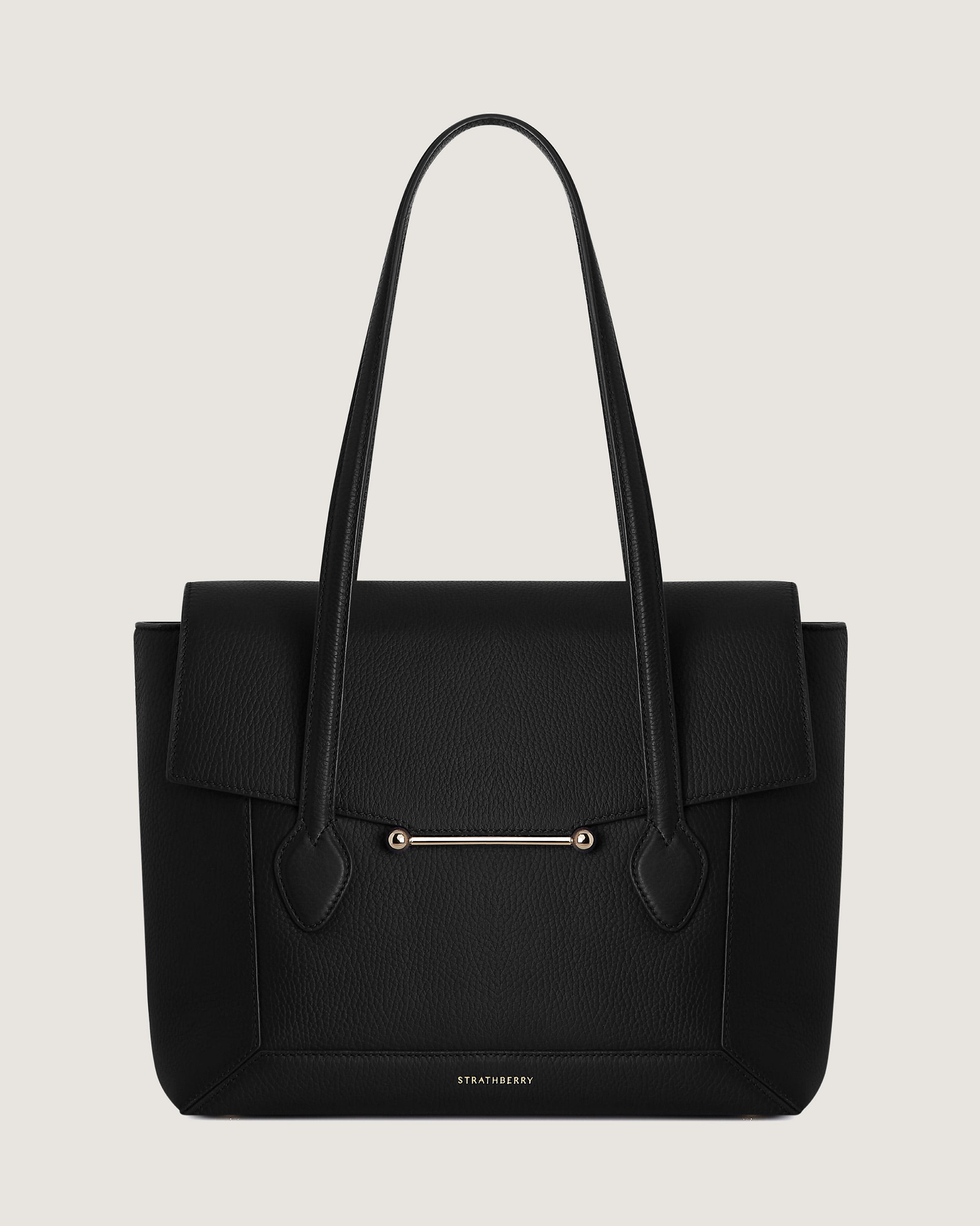 A black handbag on a white background