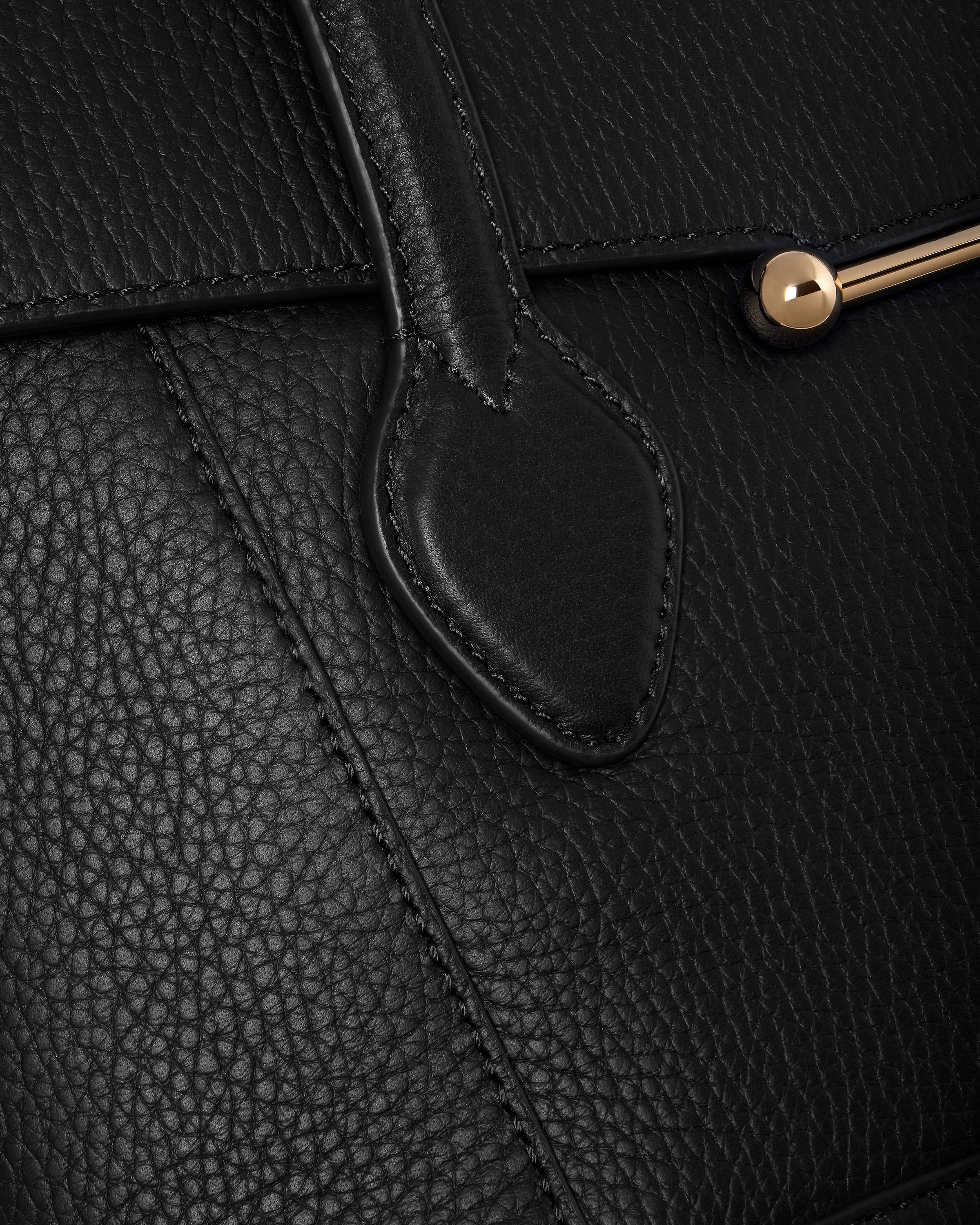 A close up of a black leather purse