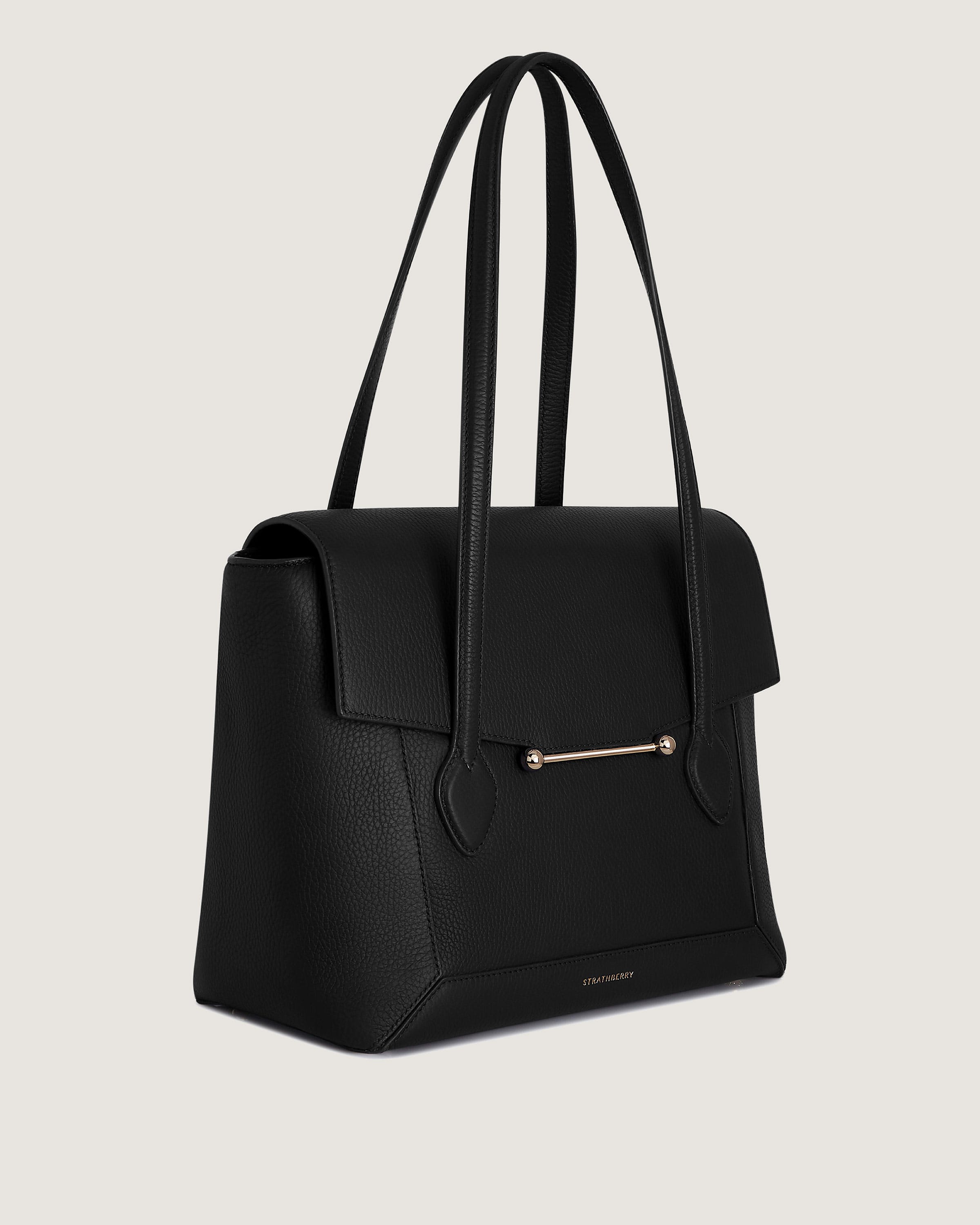 A black handbag on a white background