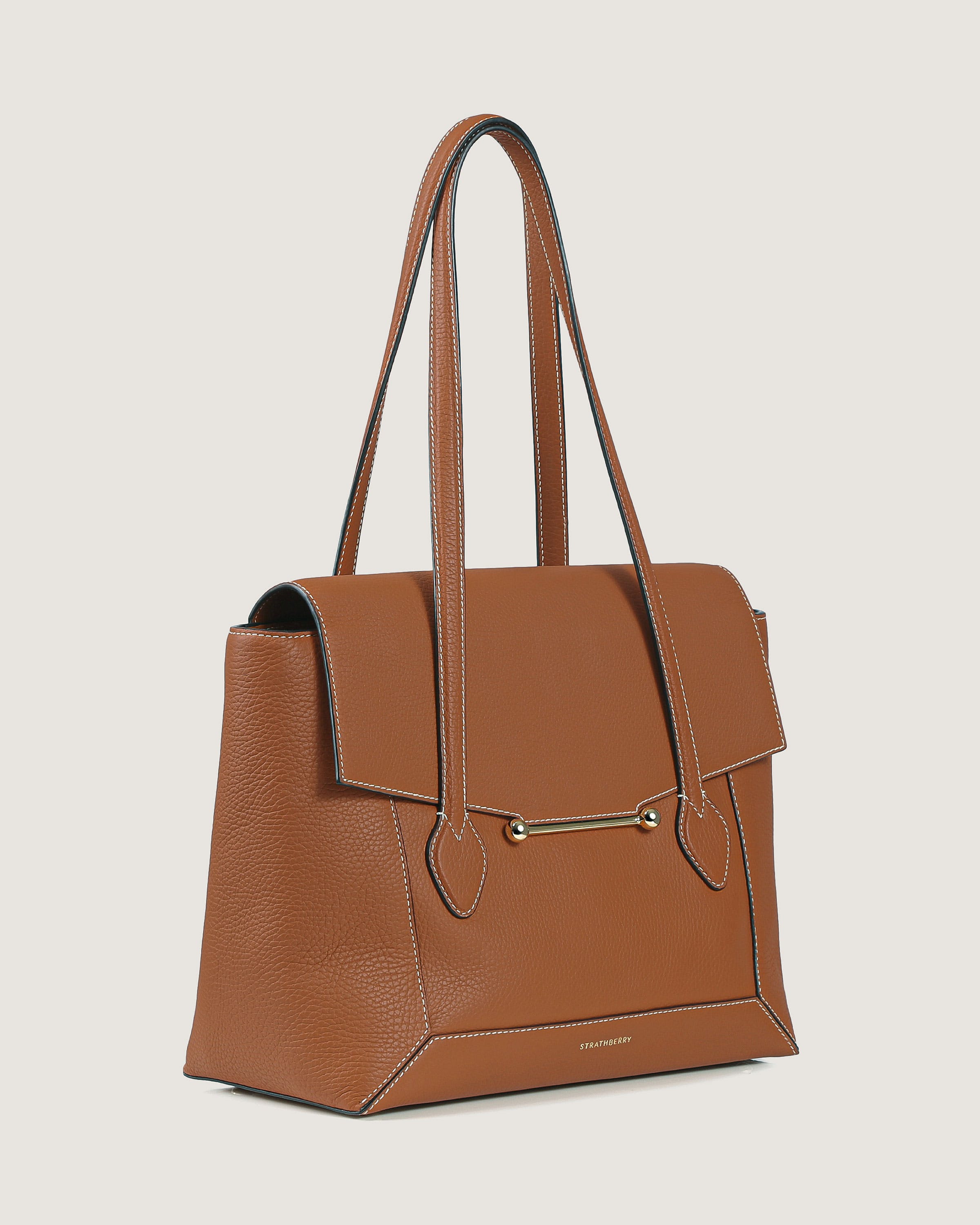 A brown leather handbag with a zipper