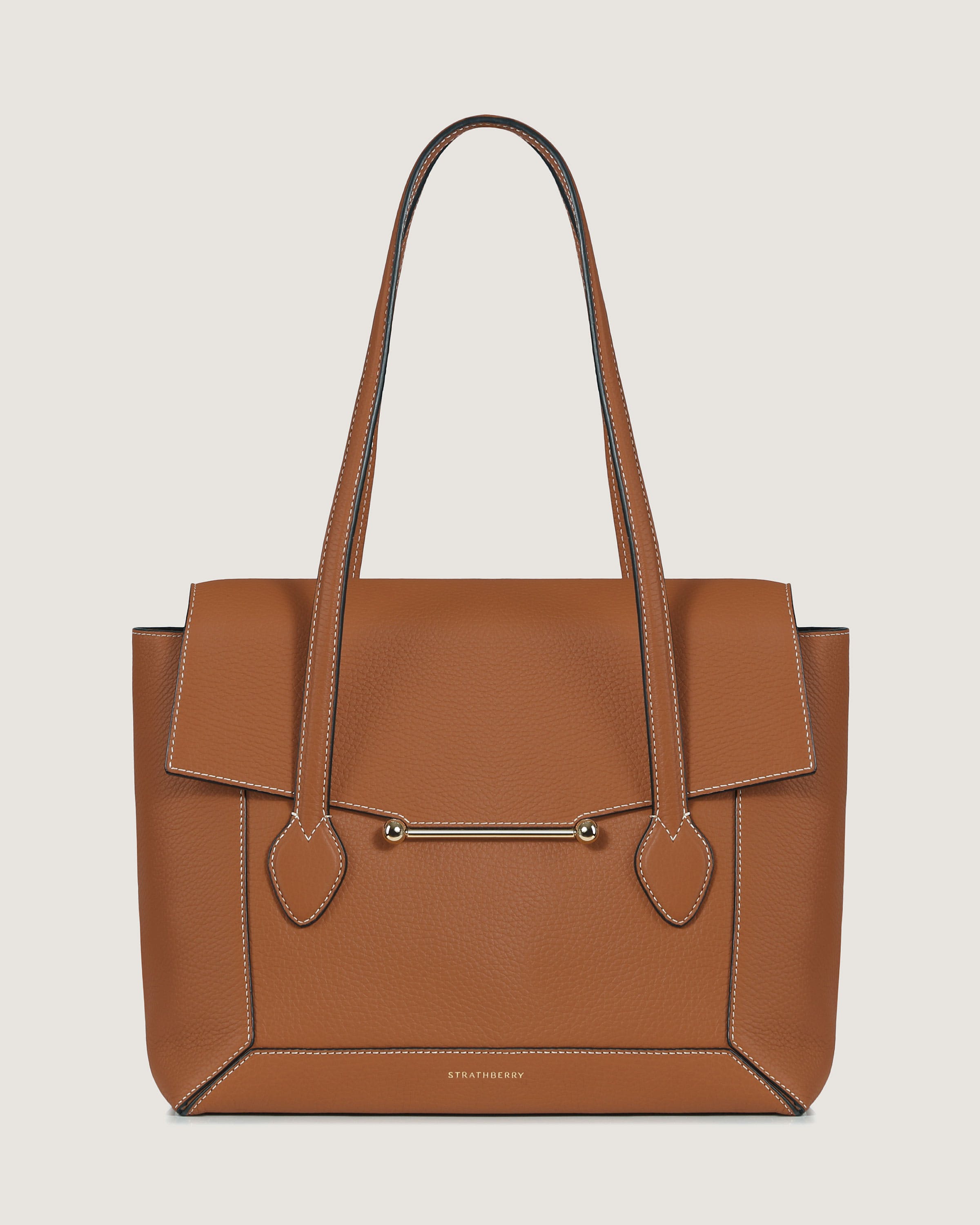 A brown leather handbag with a zipper