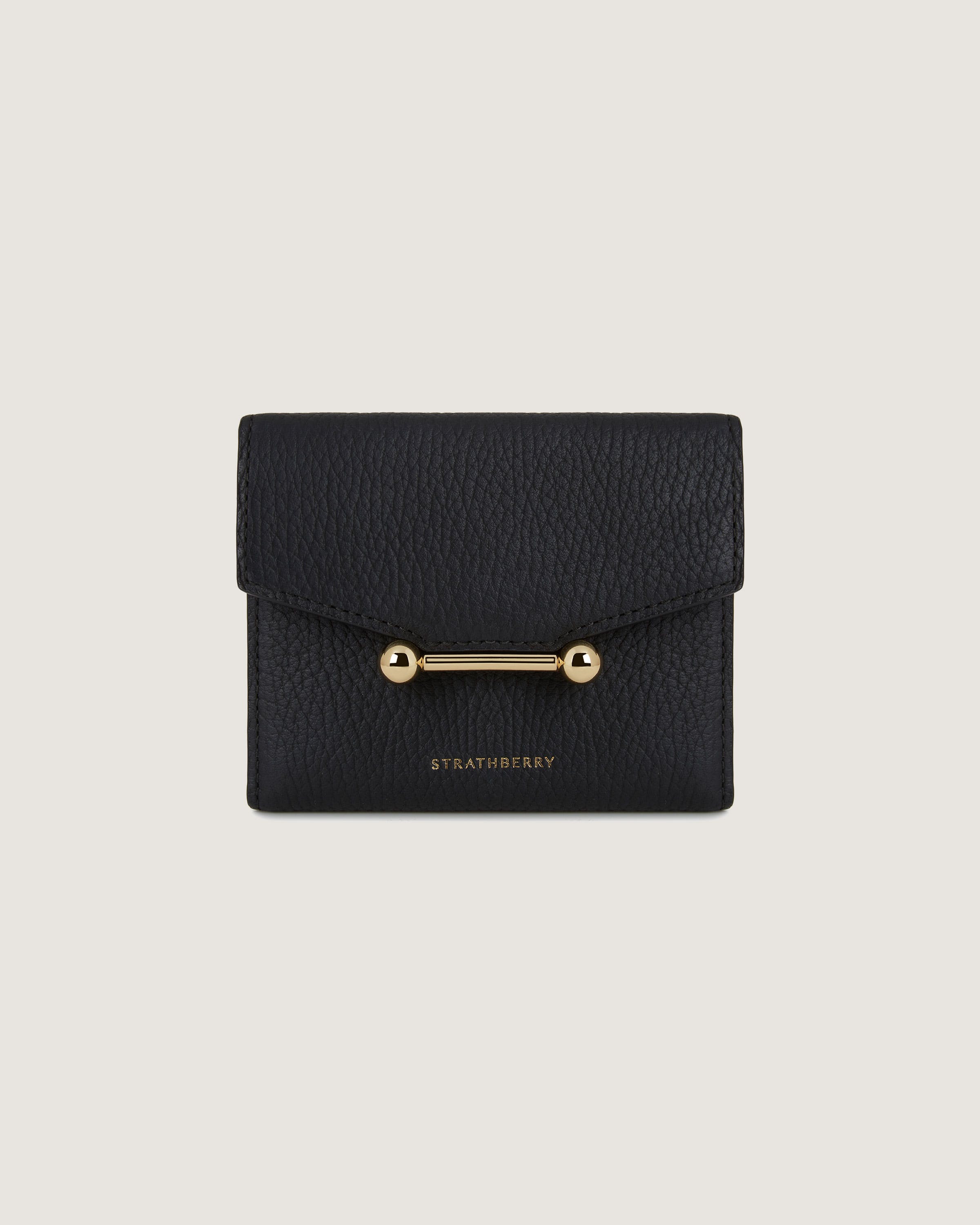 A black leather wallet with a gold clasp