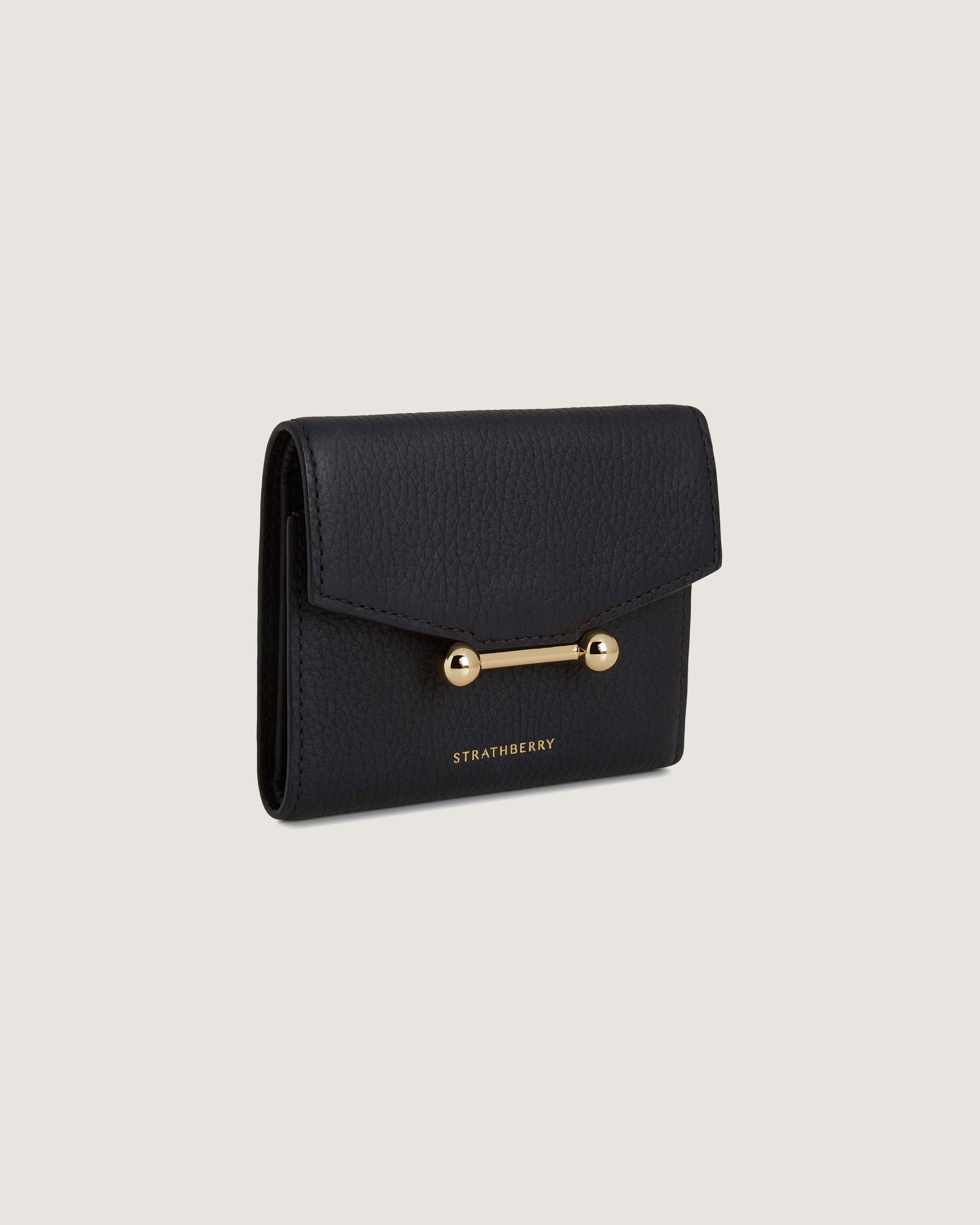 A black wallet with a gold handle