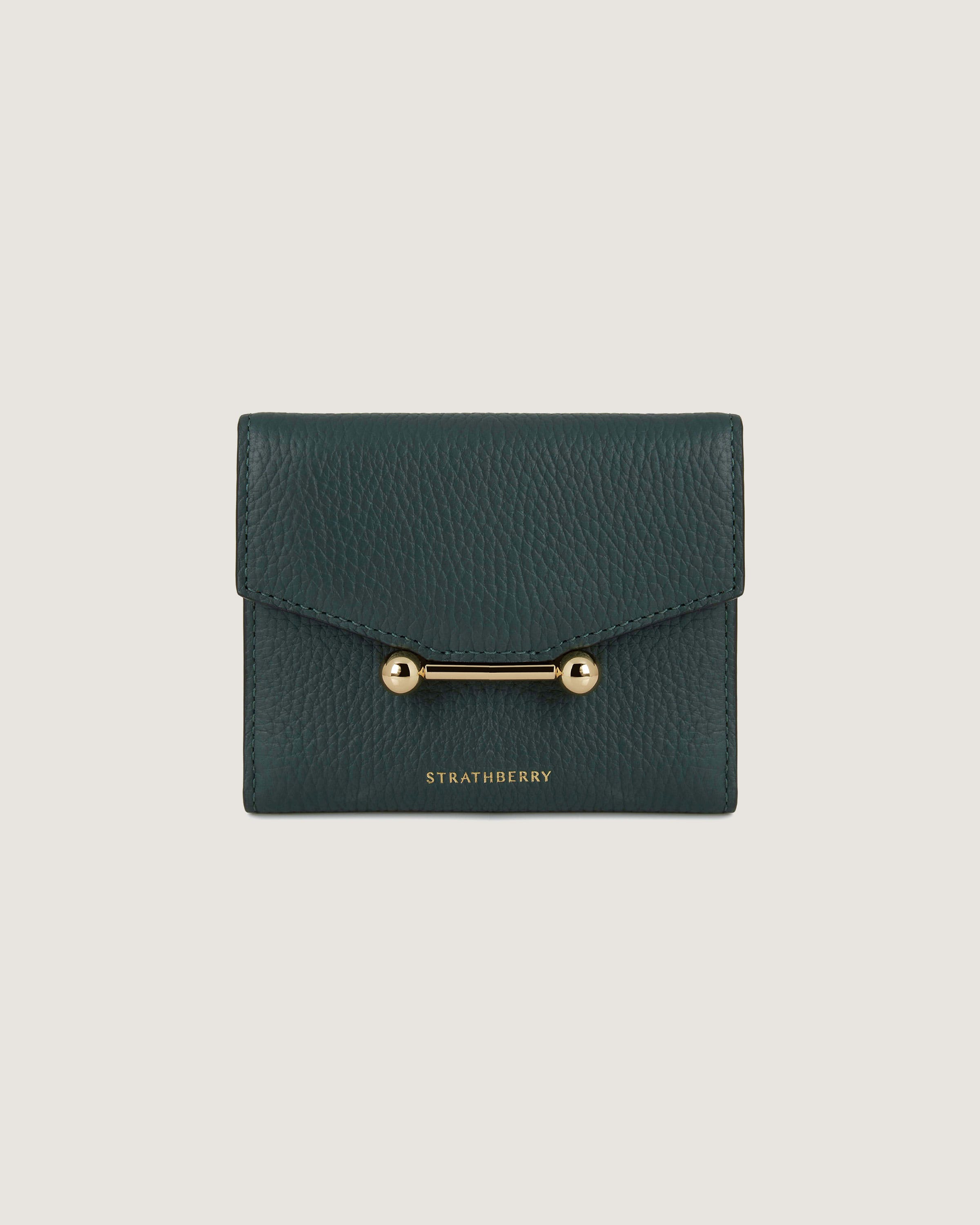 A green leather wallet with a gold clasp