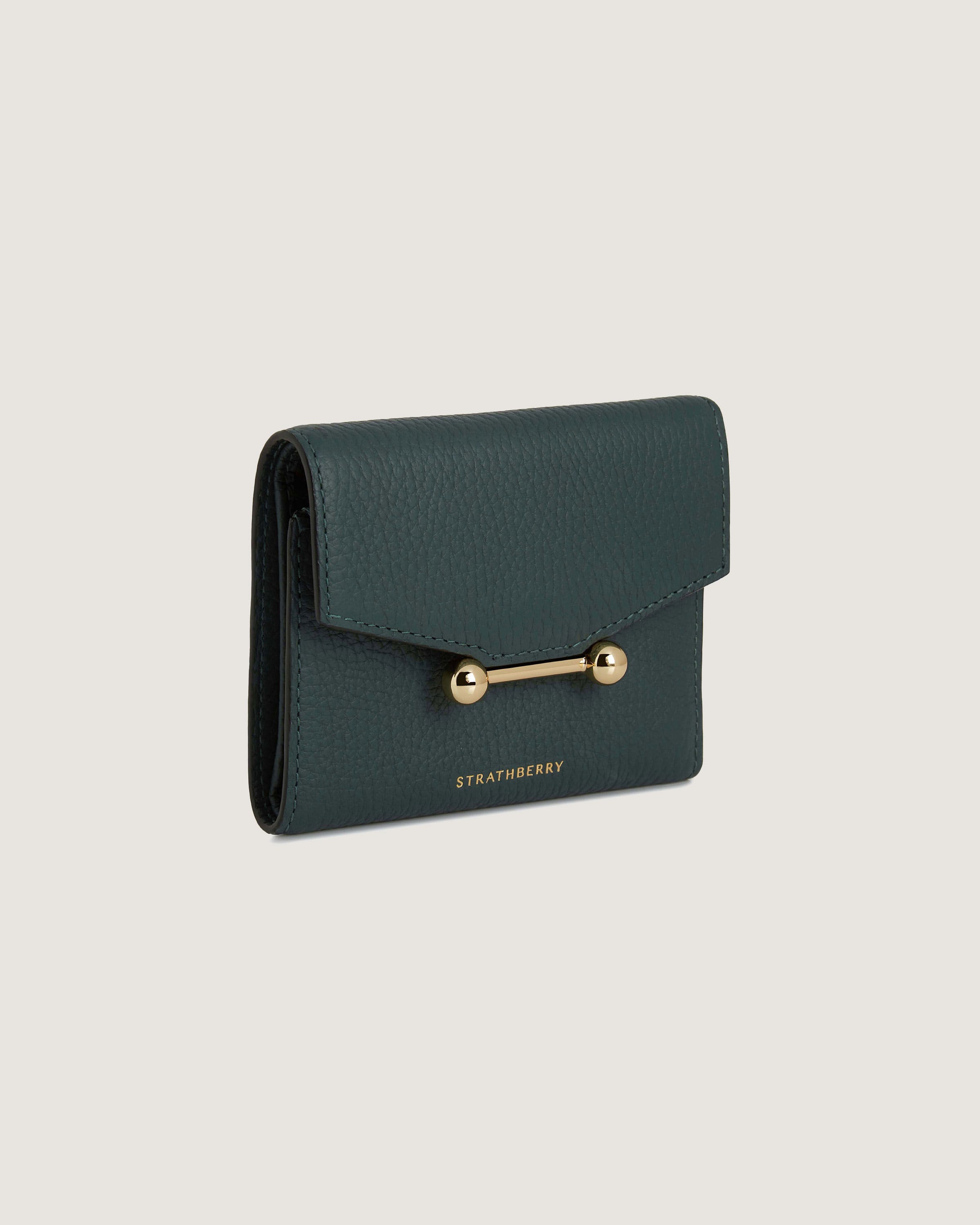 A green leather wallet with a gold clasp