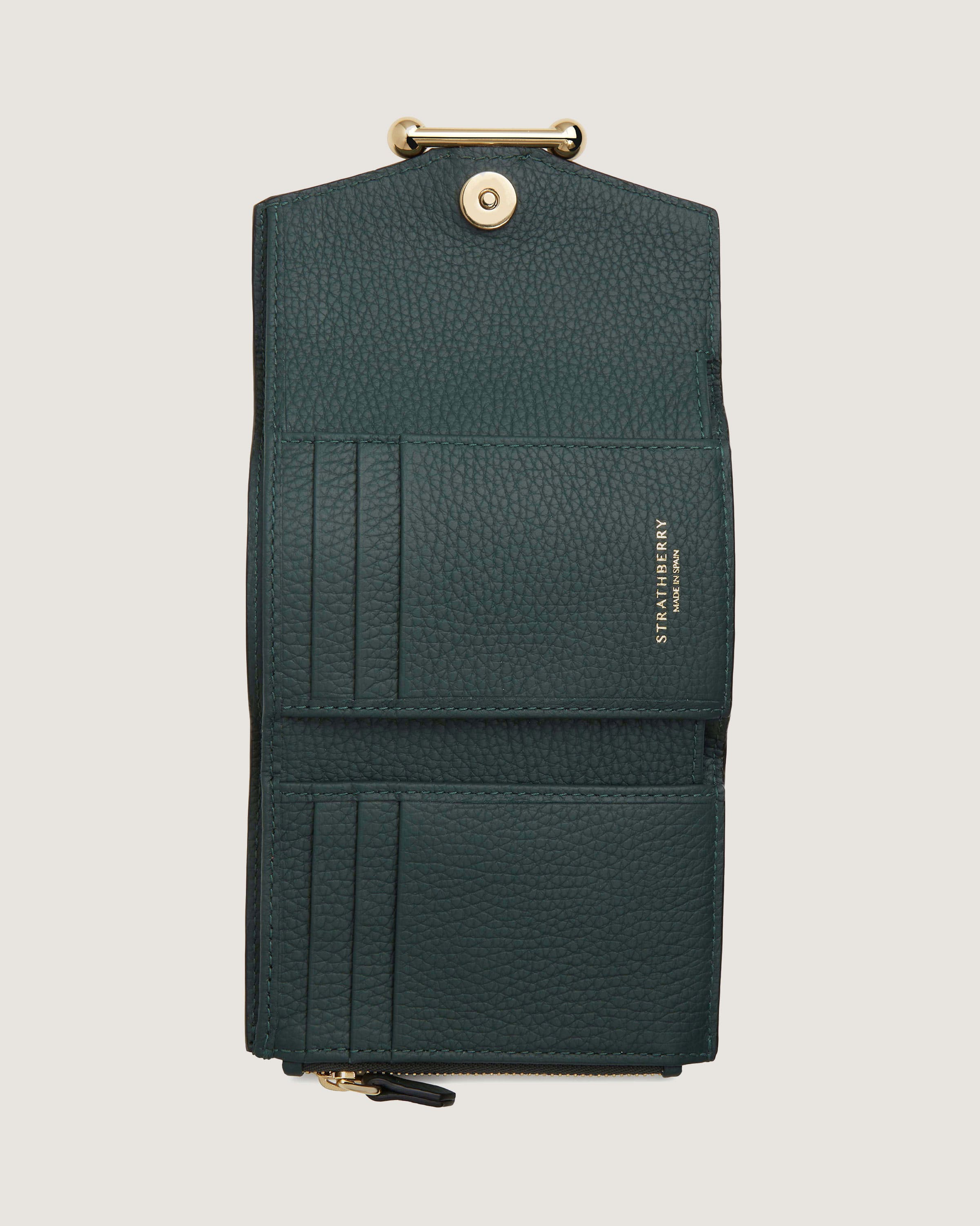 A green leather wallet with a gold clasp