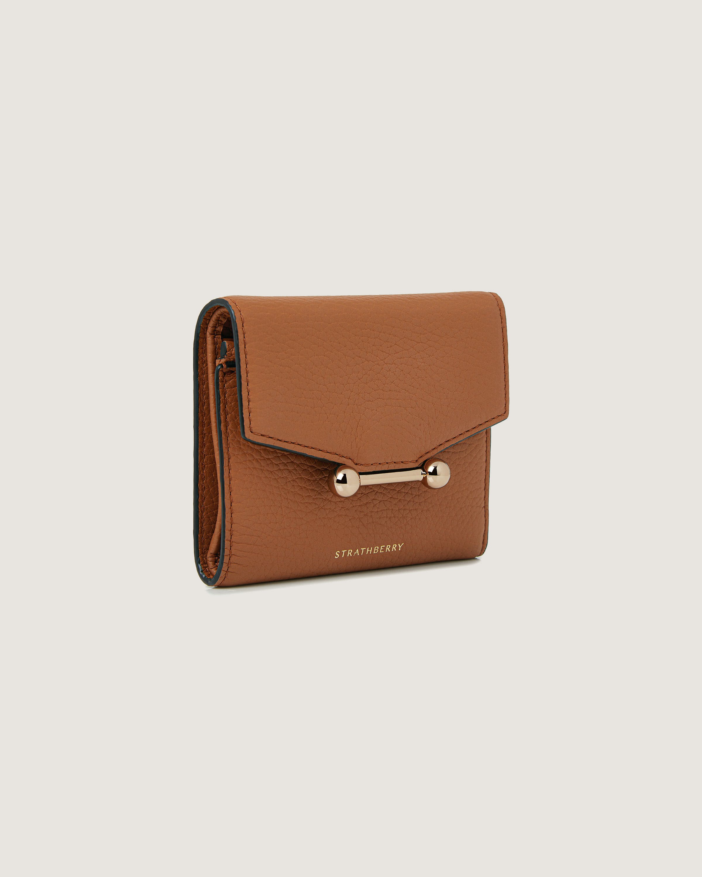 A brown leather wallet with a gold clasp