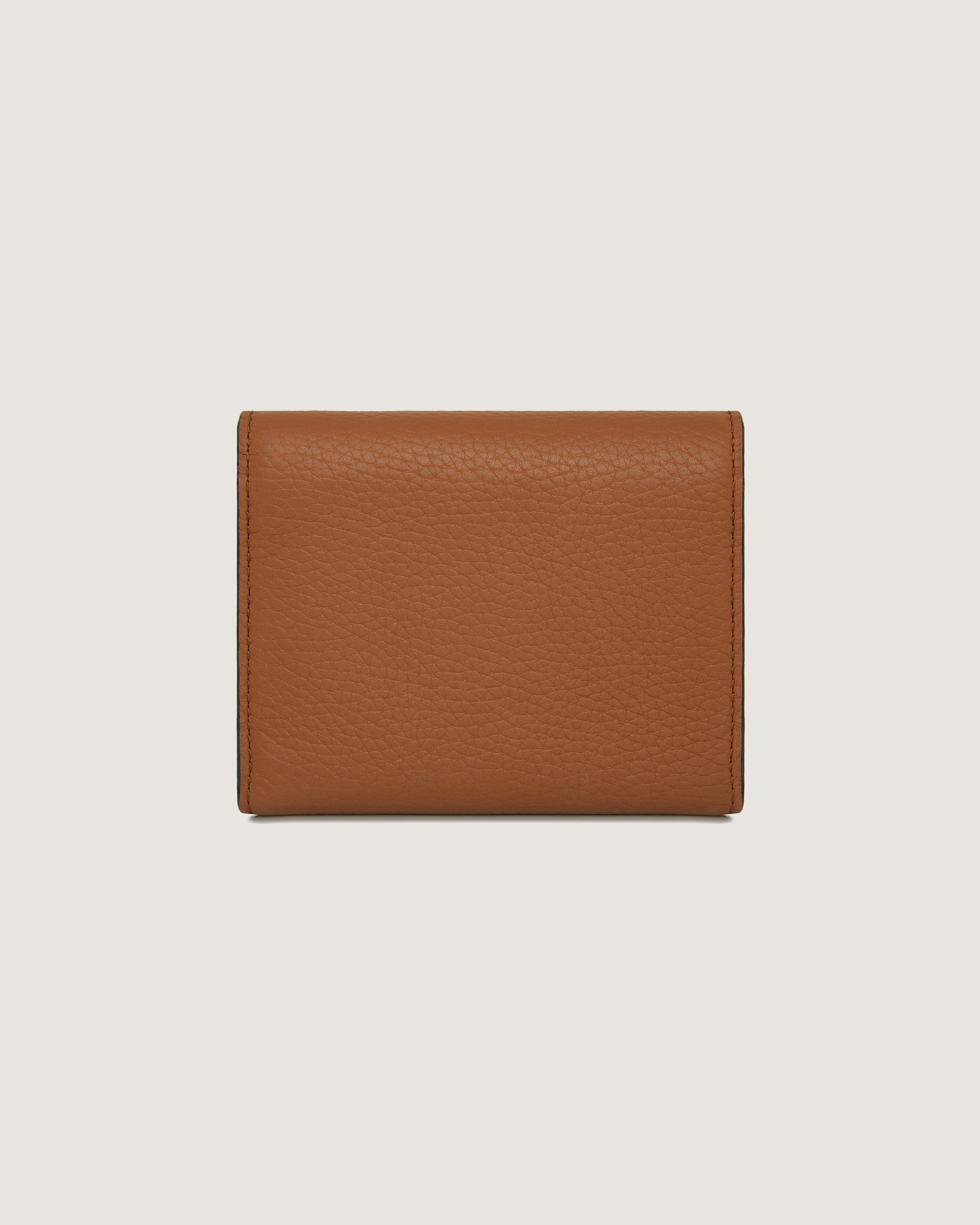 A brown leather wallet on a white background