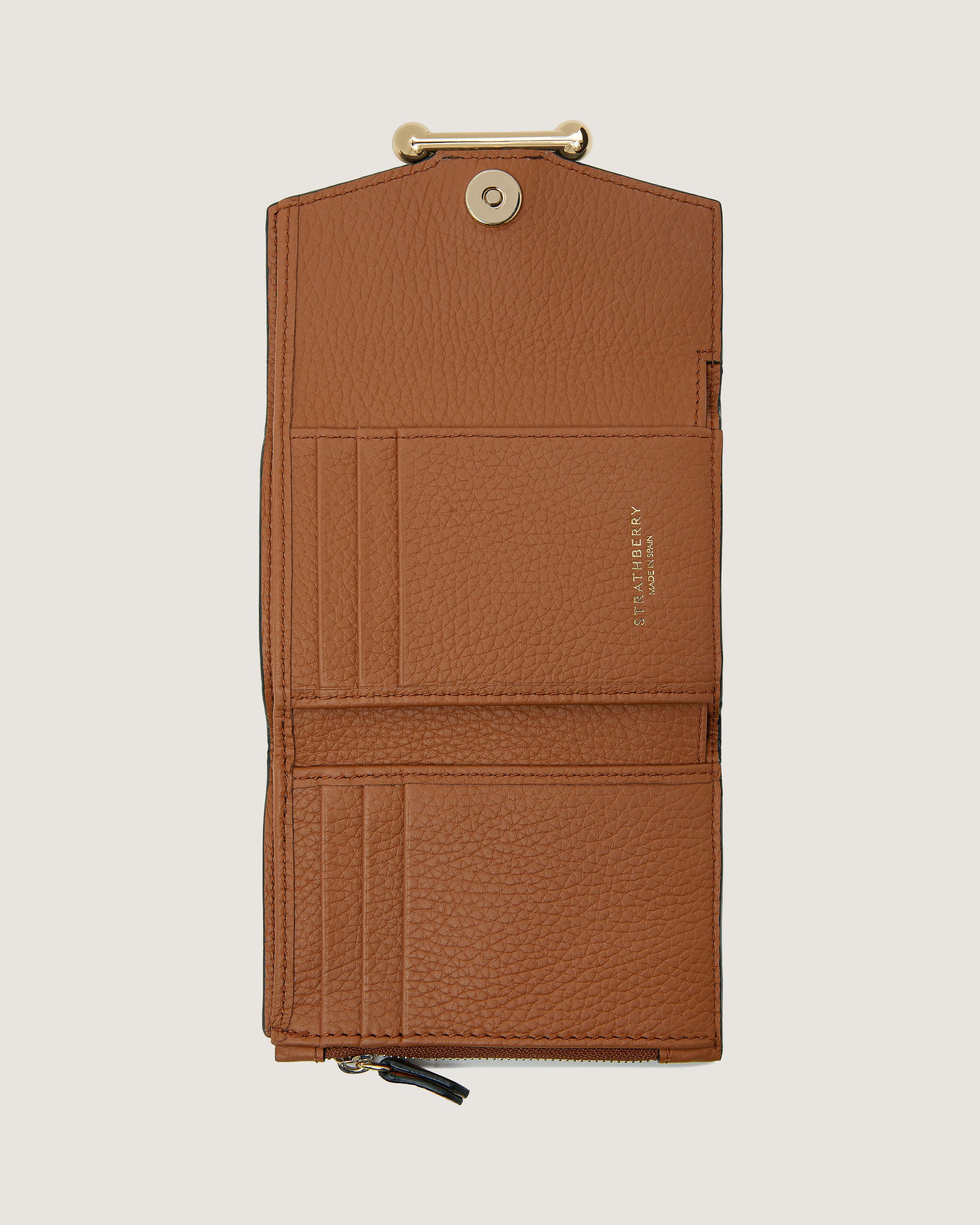 A brown wallet with a card holder attached to it