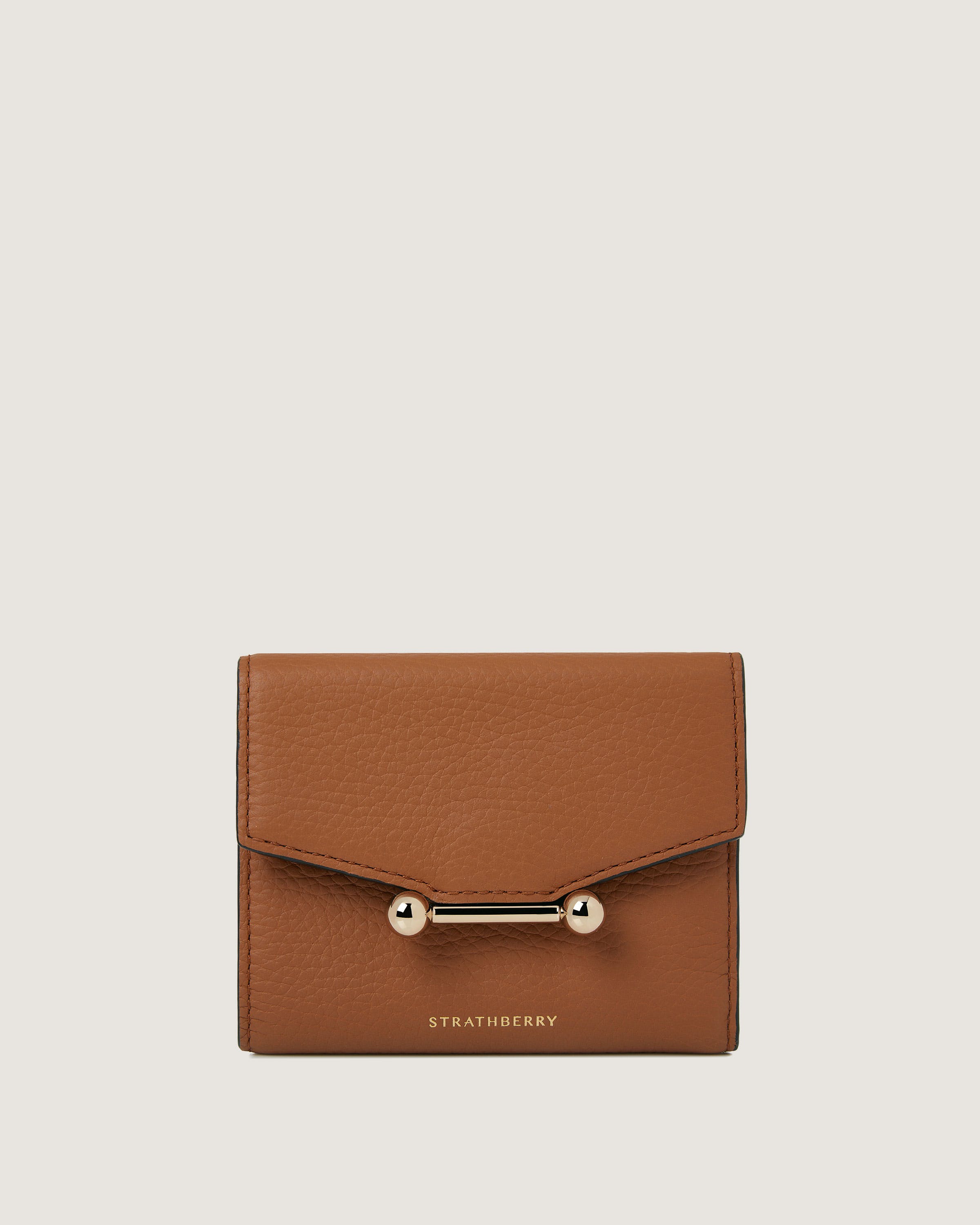 A brown wallet with a gold handle