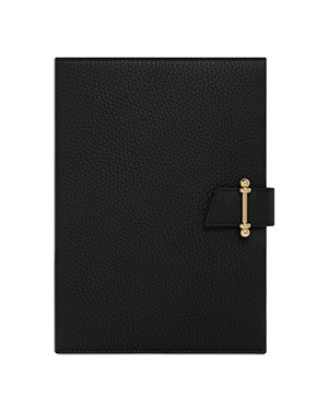 A black notebook with a gold handle