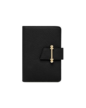 A black leather notebook with a gold clasp