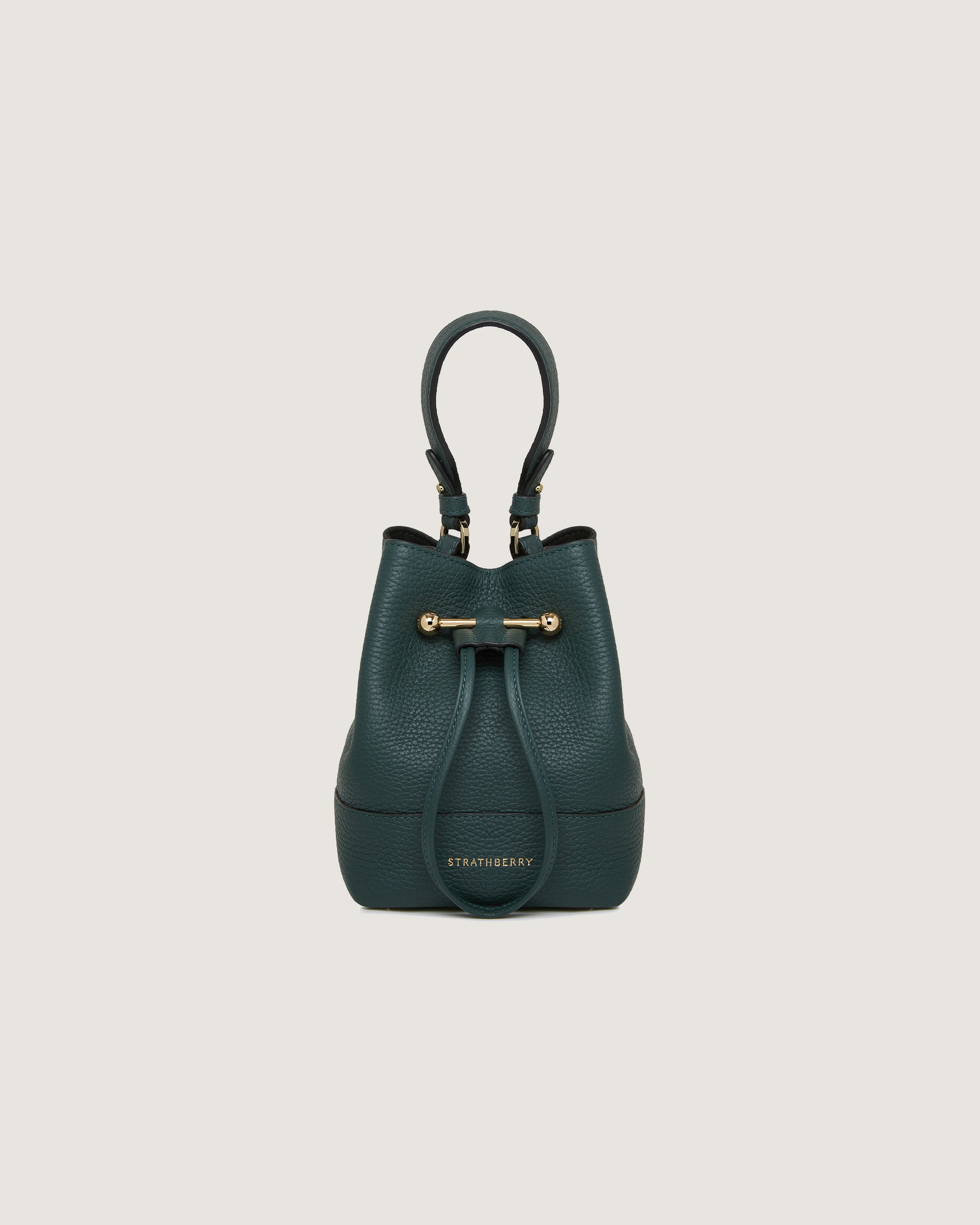 A green leather handbag with a handle