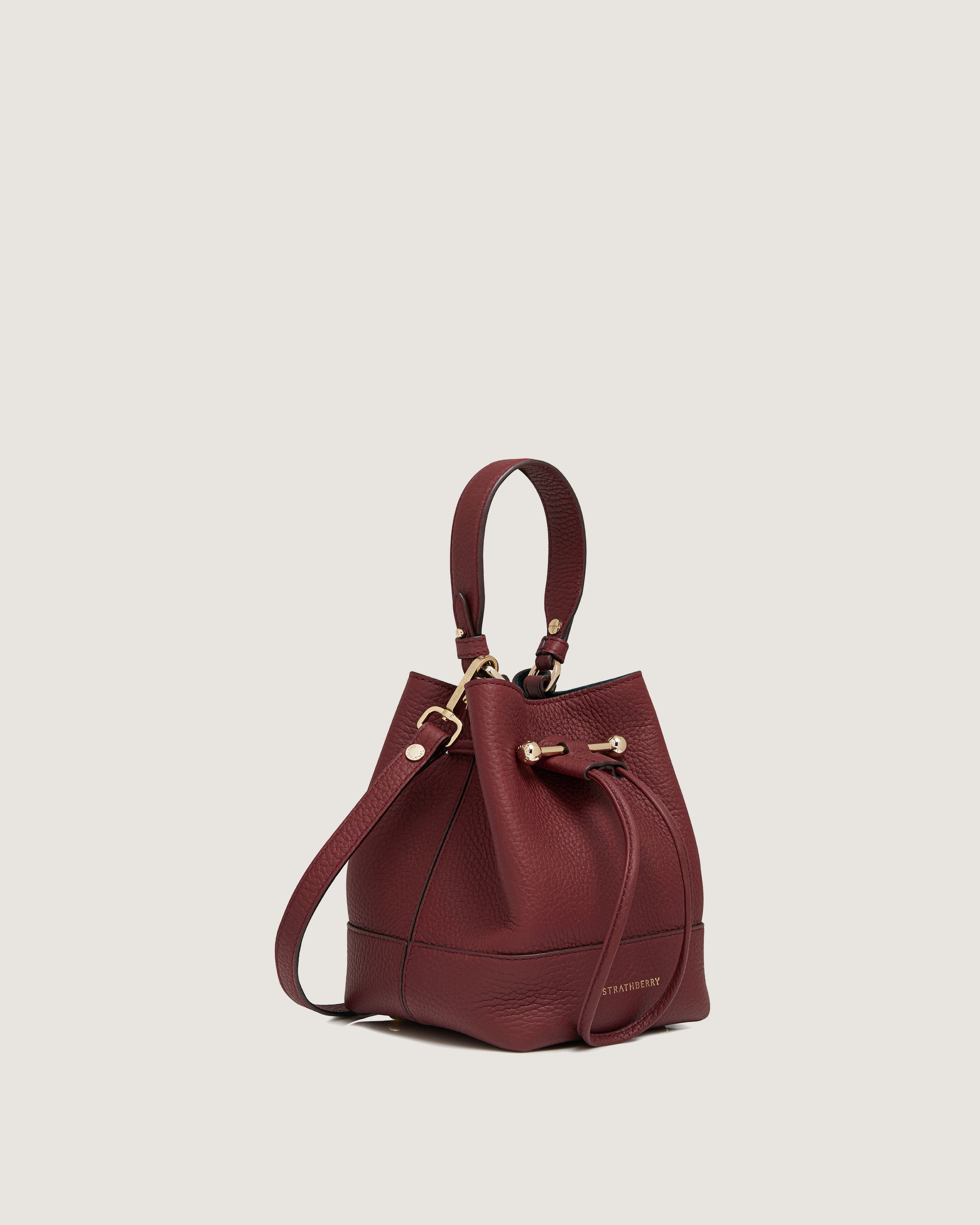 A red handbag on a white background