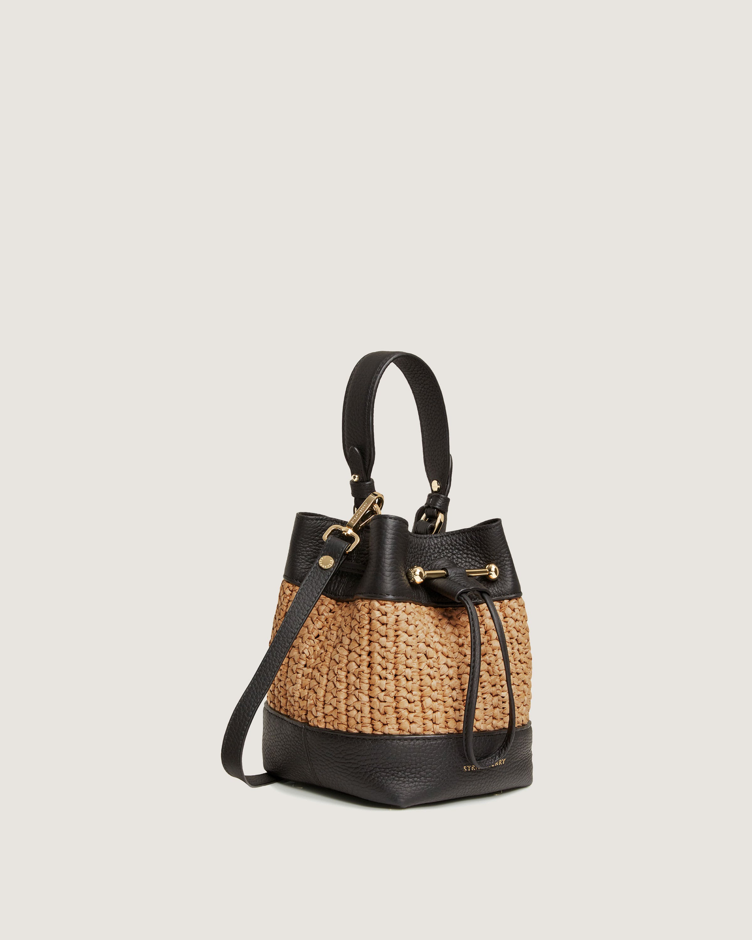 A straw bag with a leather handle