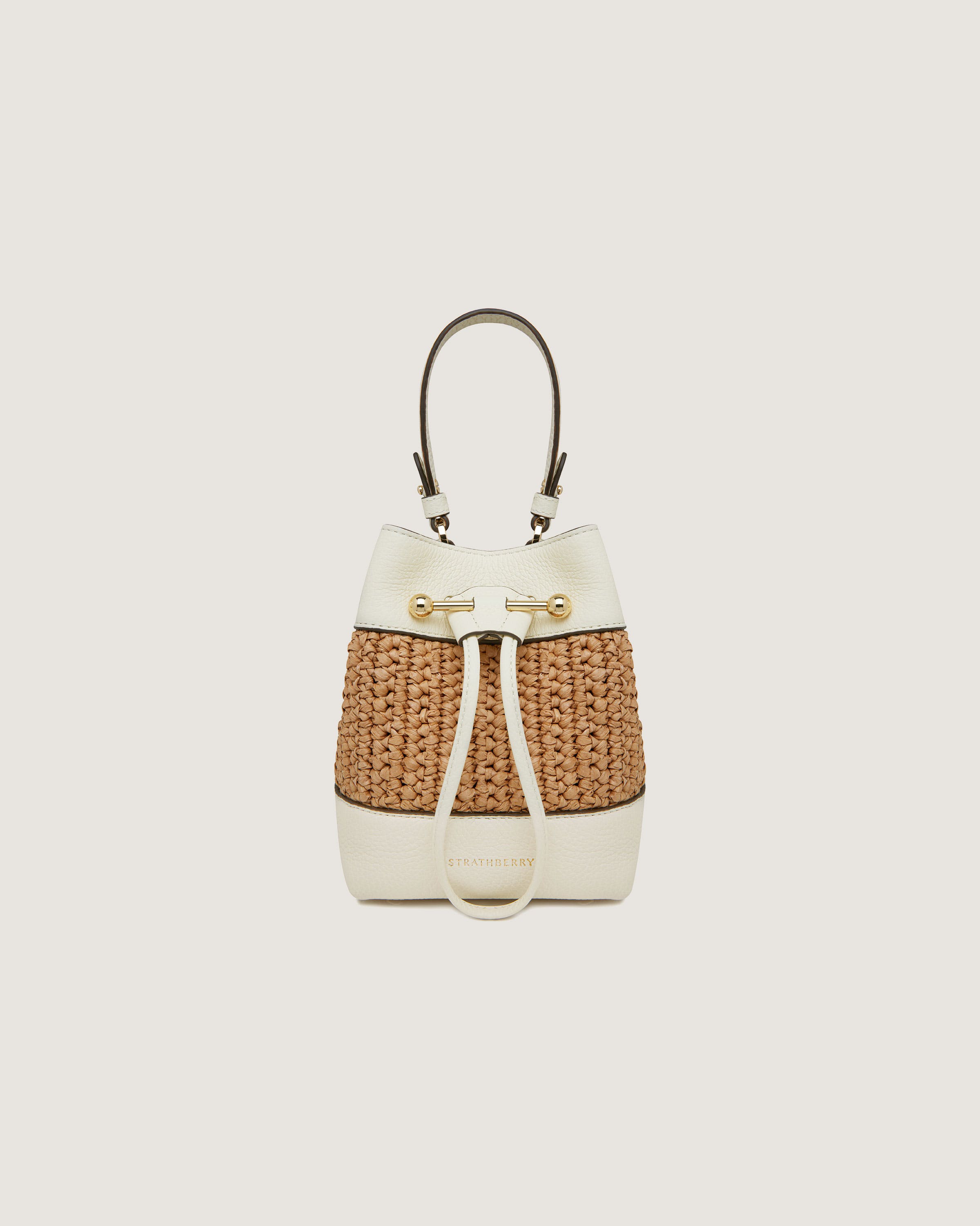 A white and brown handbag with a handle