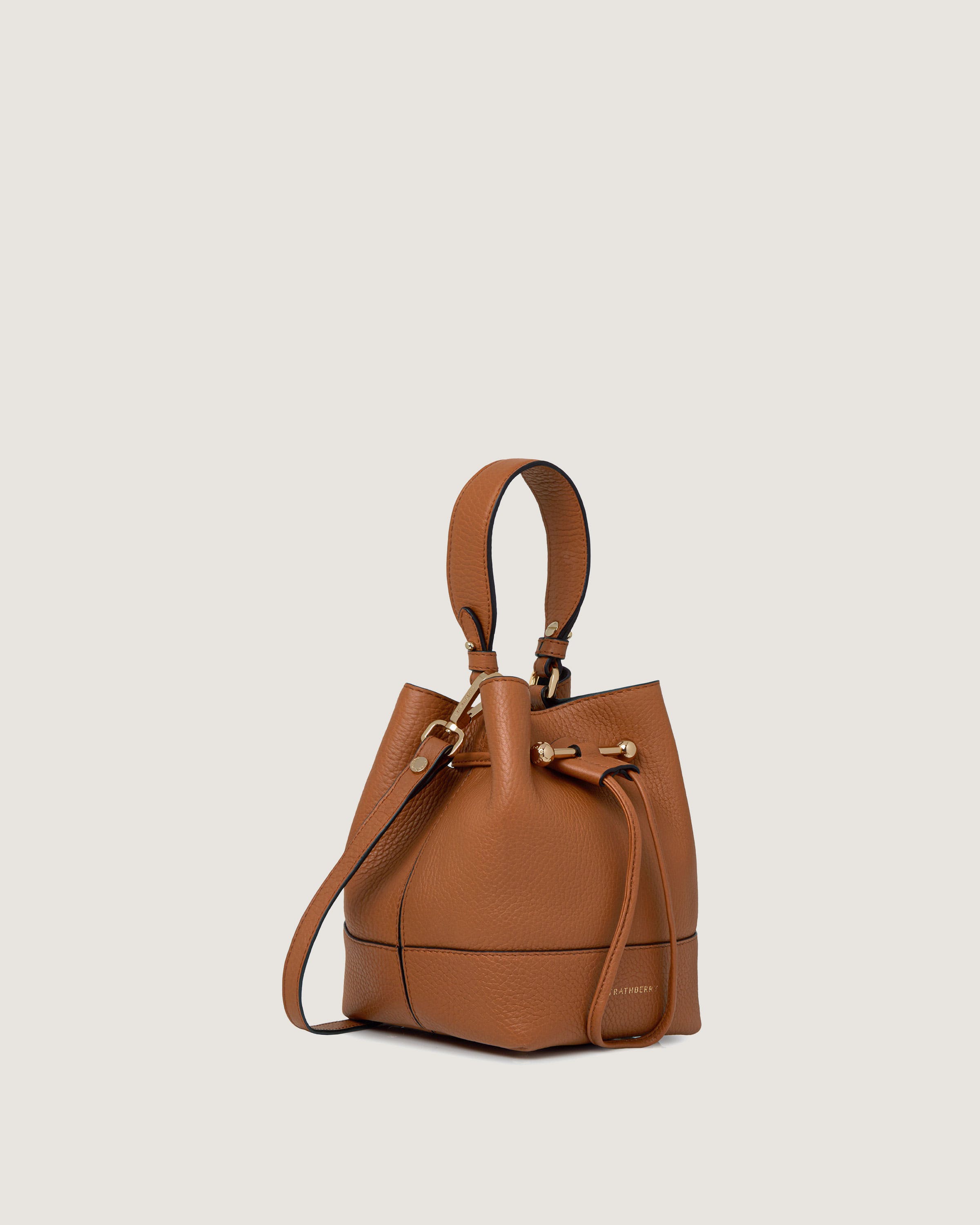 A brown leather handbag with a strap