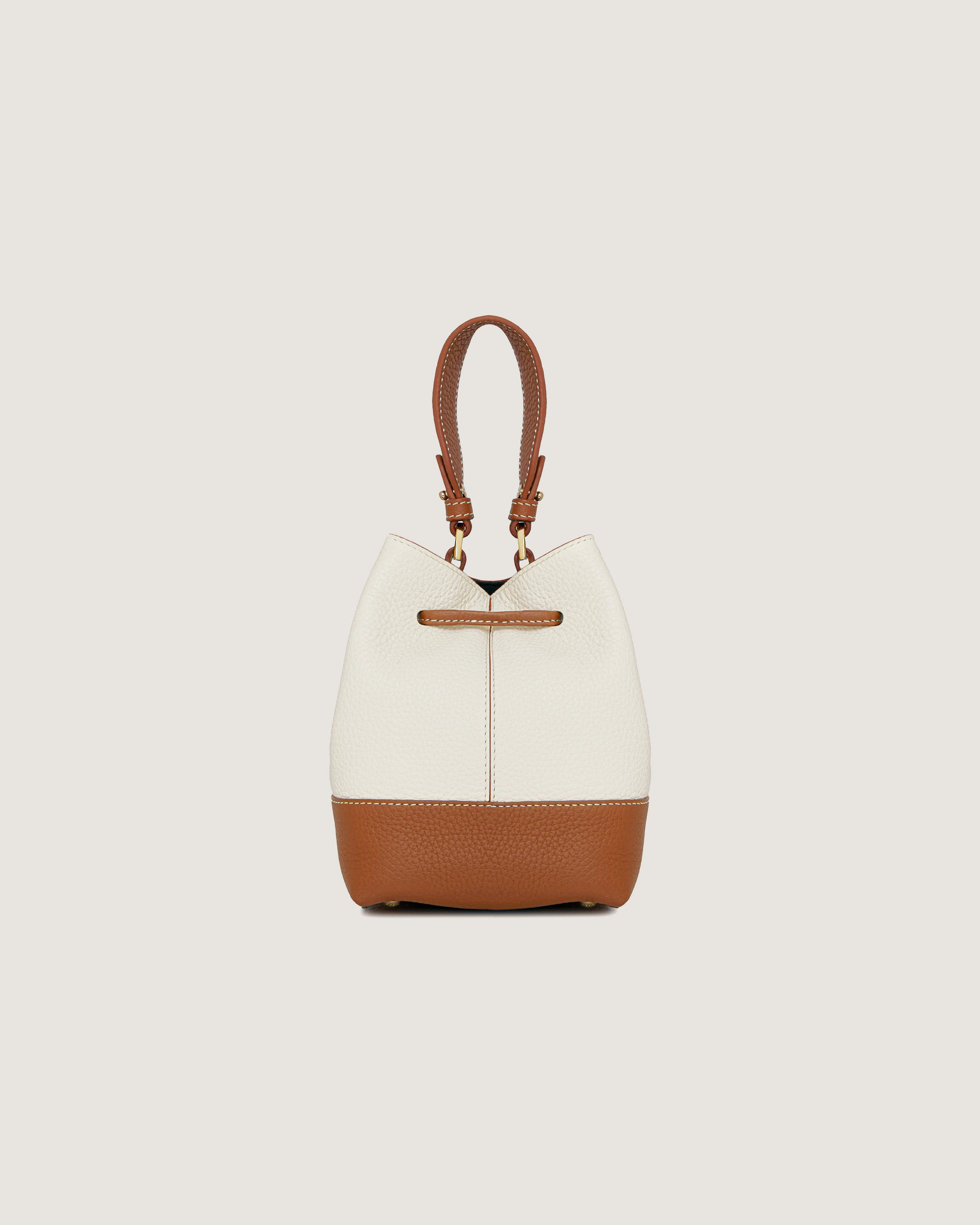 A white and brown handbag on a white background