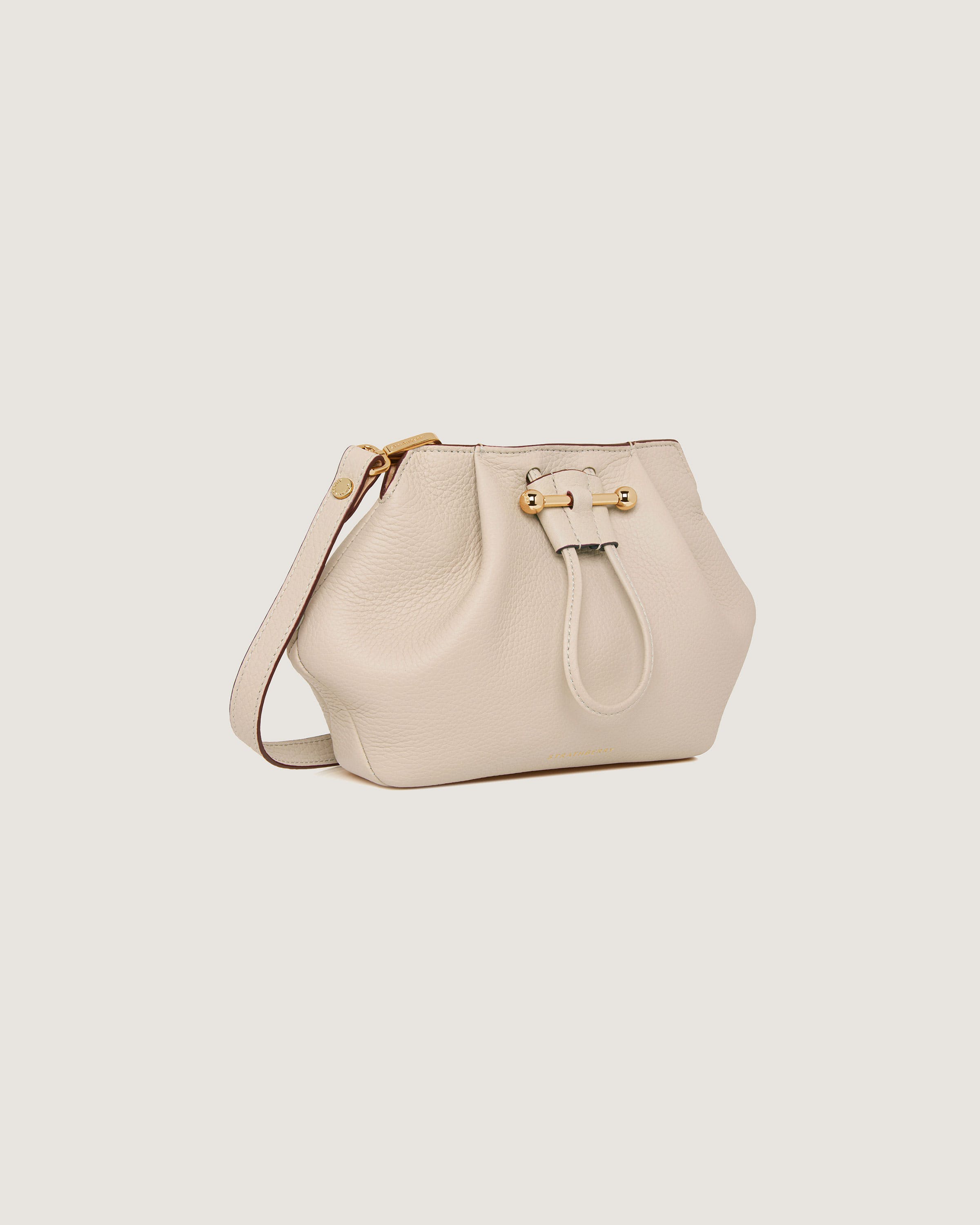 A white handbag with a handle on a white background