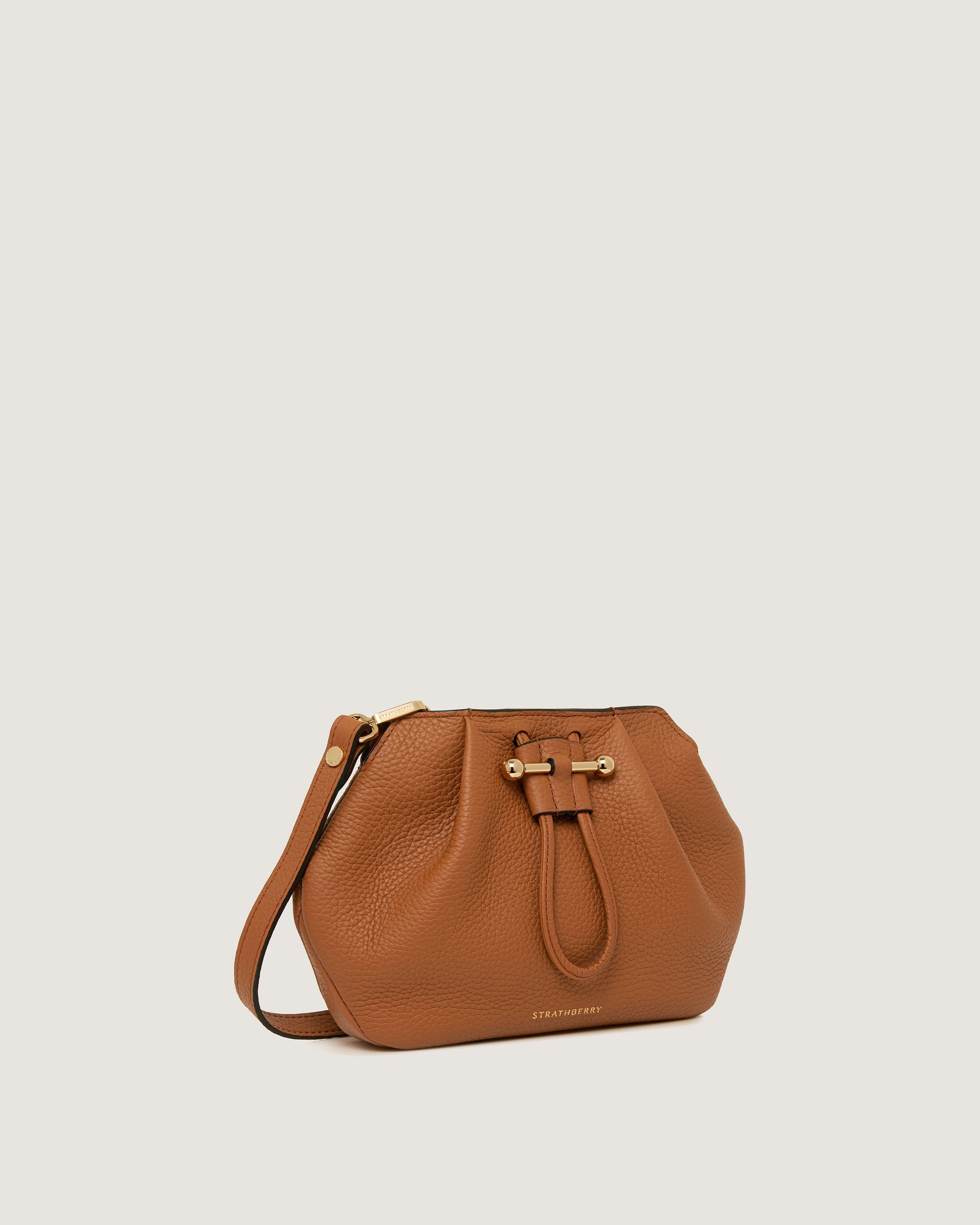 A brown leather handbag with a gold buckle