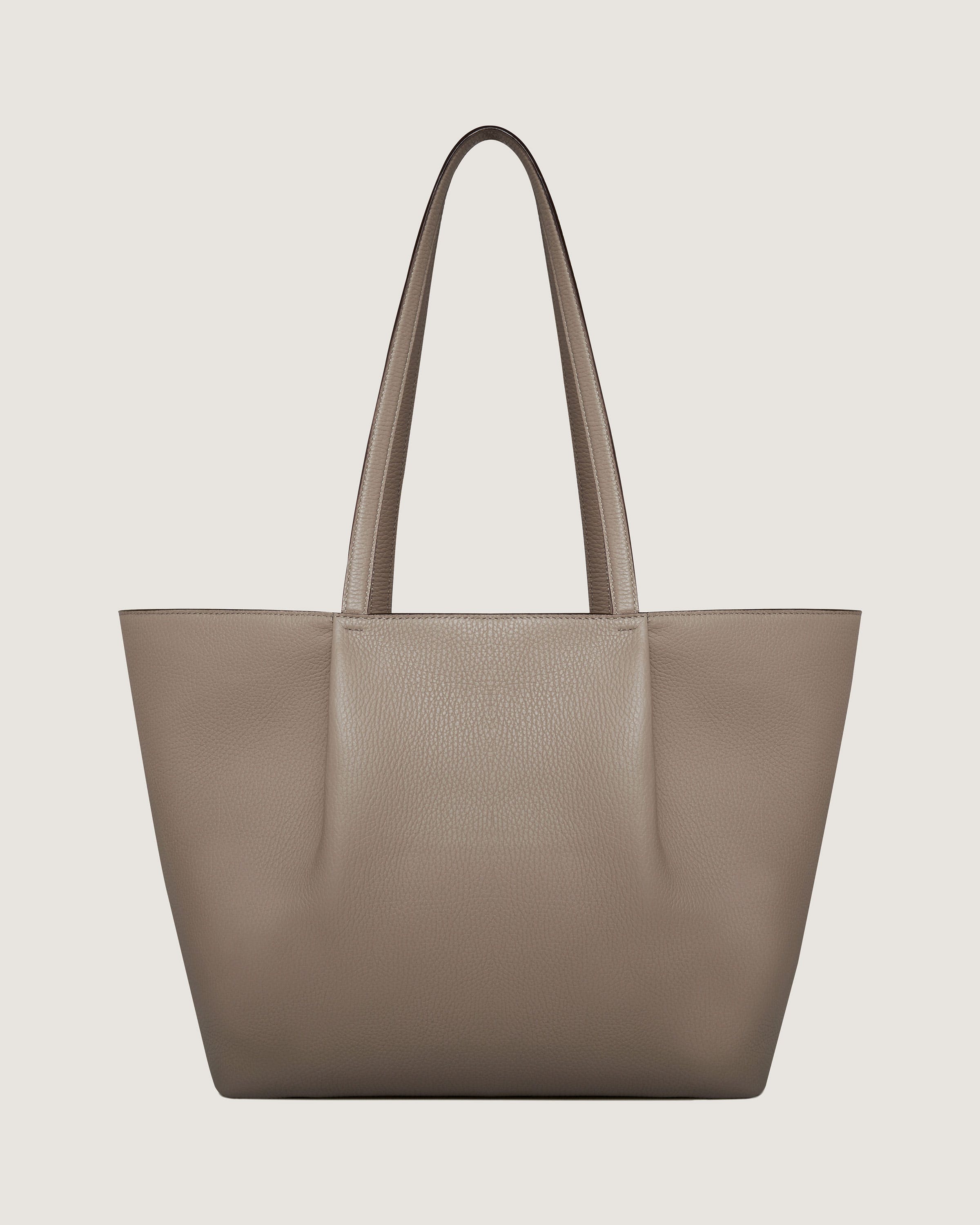 A beige tote bag on a white background