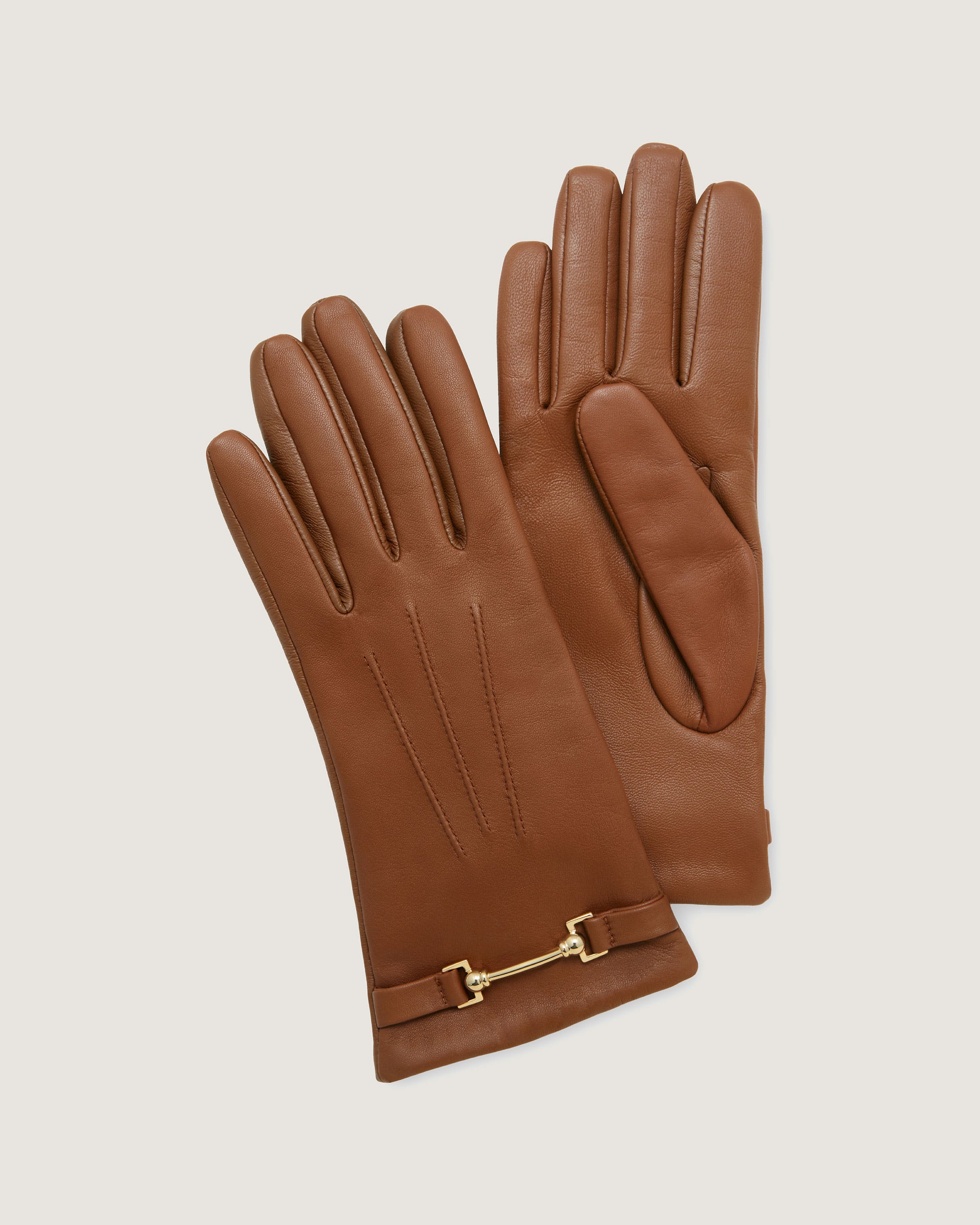 A pair of brown leather gloves on a white background