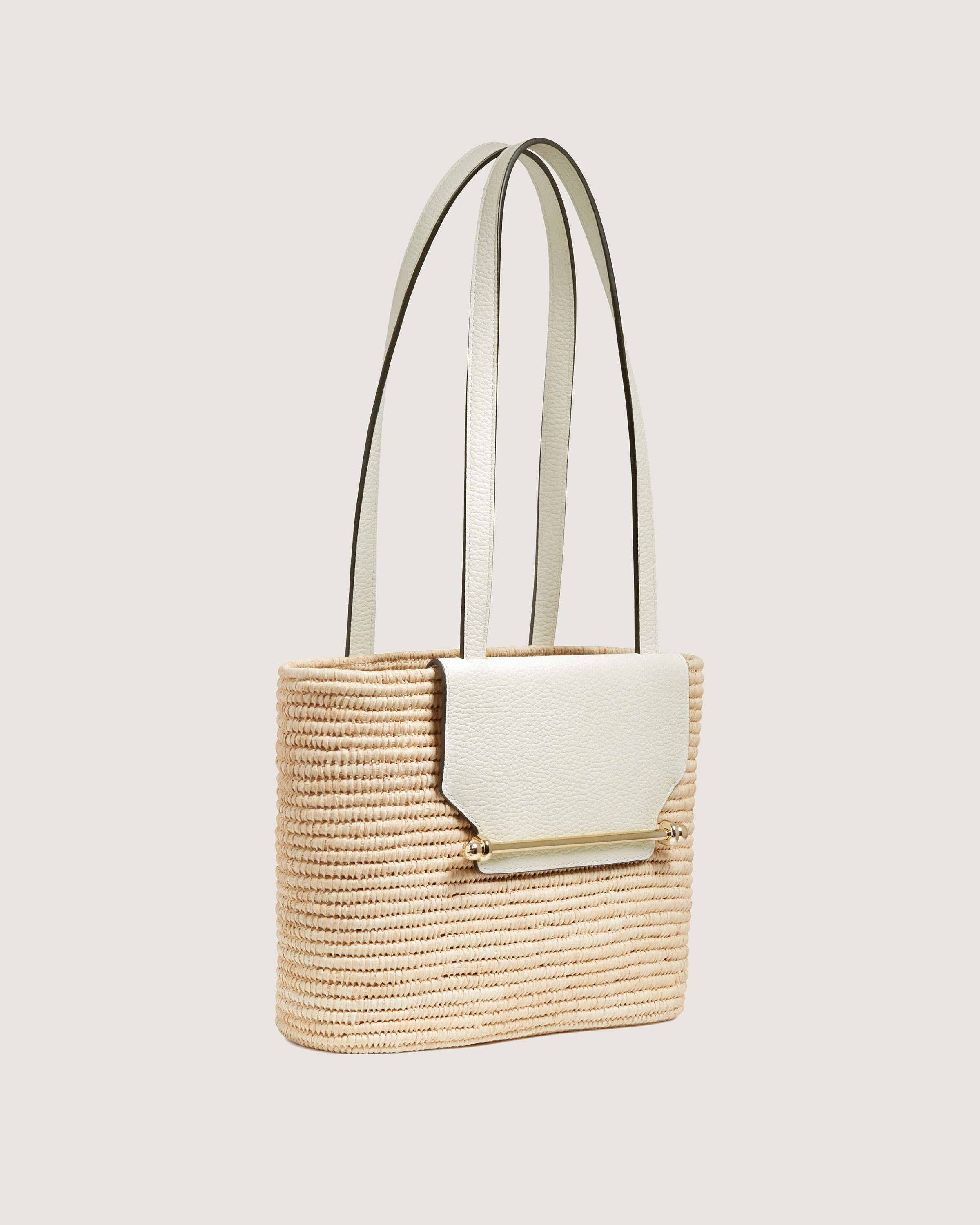 A handbag with a handle hanging from it