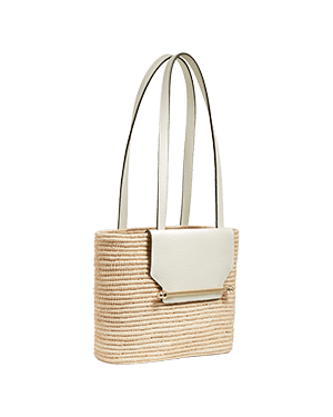 A straw bag with a white handle