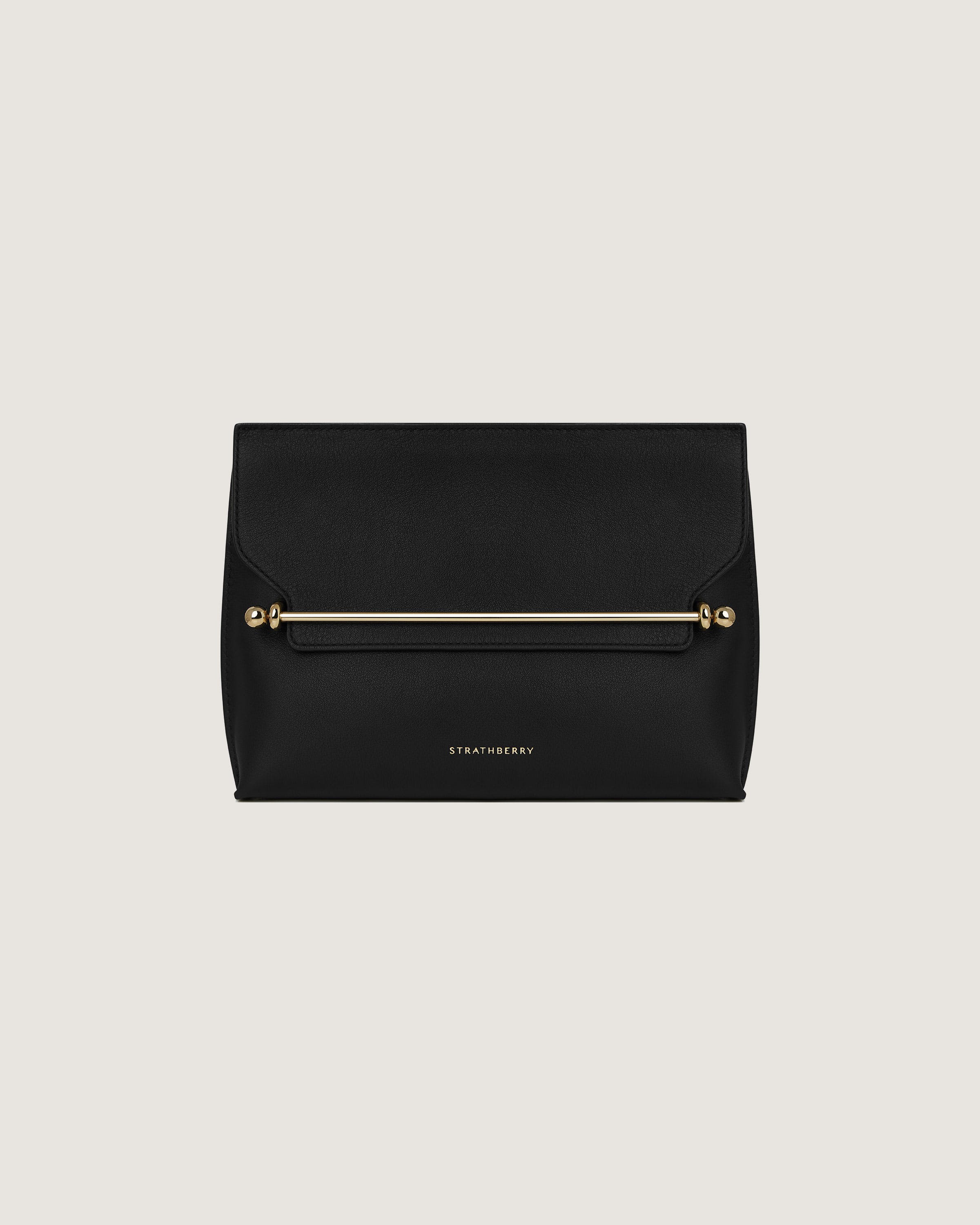 A black clutch bag with a gold zipper