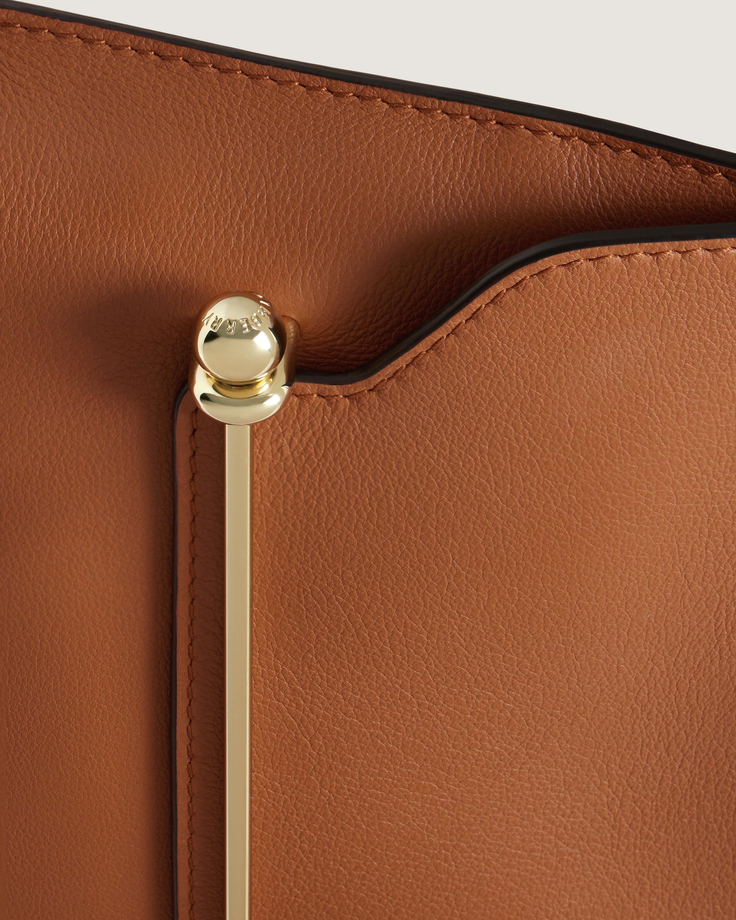 A close up of a brown leather purse