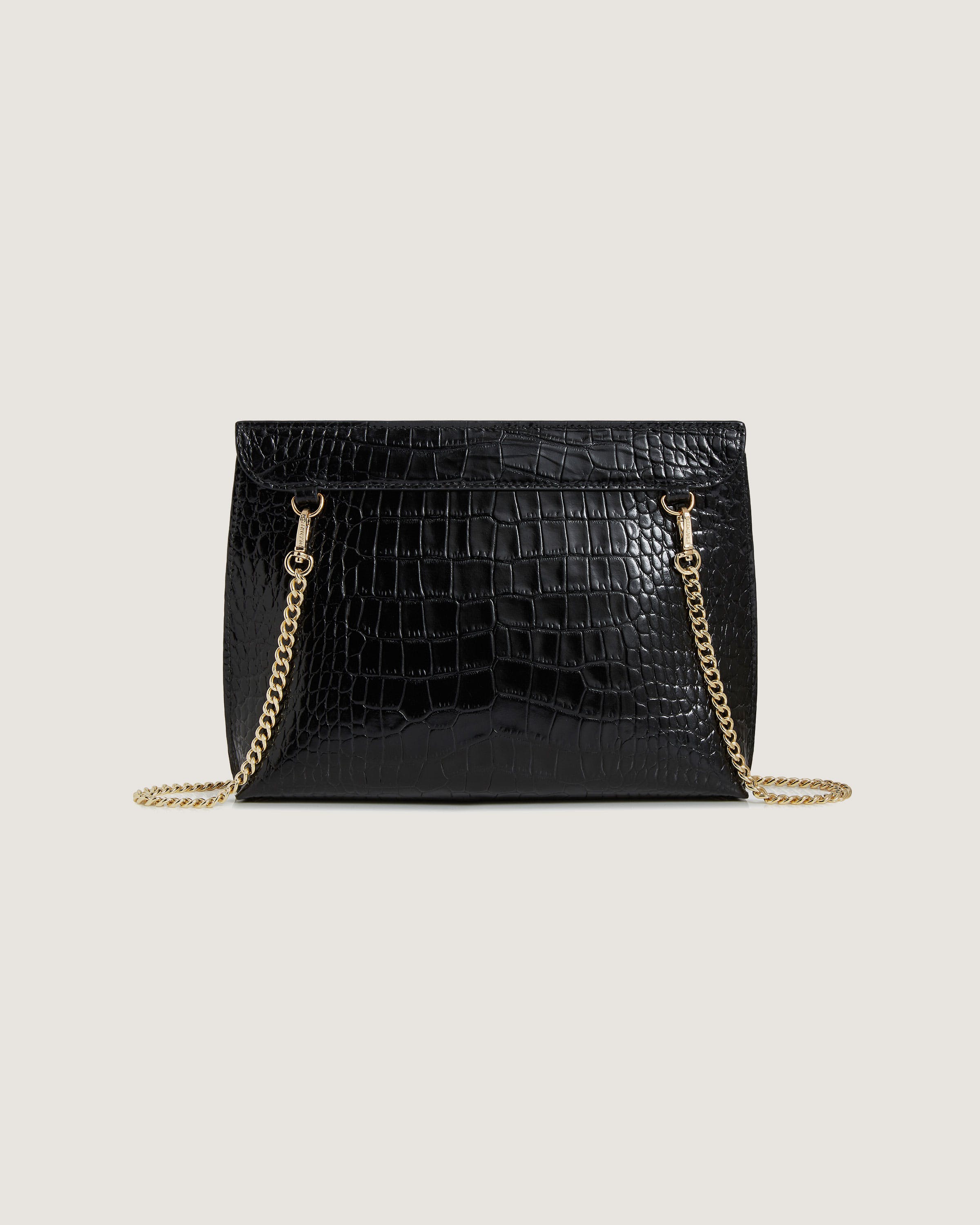 A black handbag with a gold chain