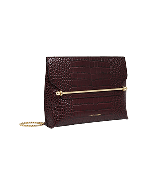 A burgundy clutch bag with a gold chain